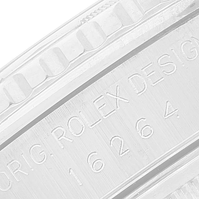 The image shows a close-up of the Rolex Turn-o-Graph 16264 Men
s Stainless Steel Black Dial 16264 Men
s Stainless Steel Black Dial model
s case side and bezel, with engraved text and serial number.