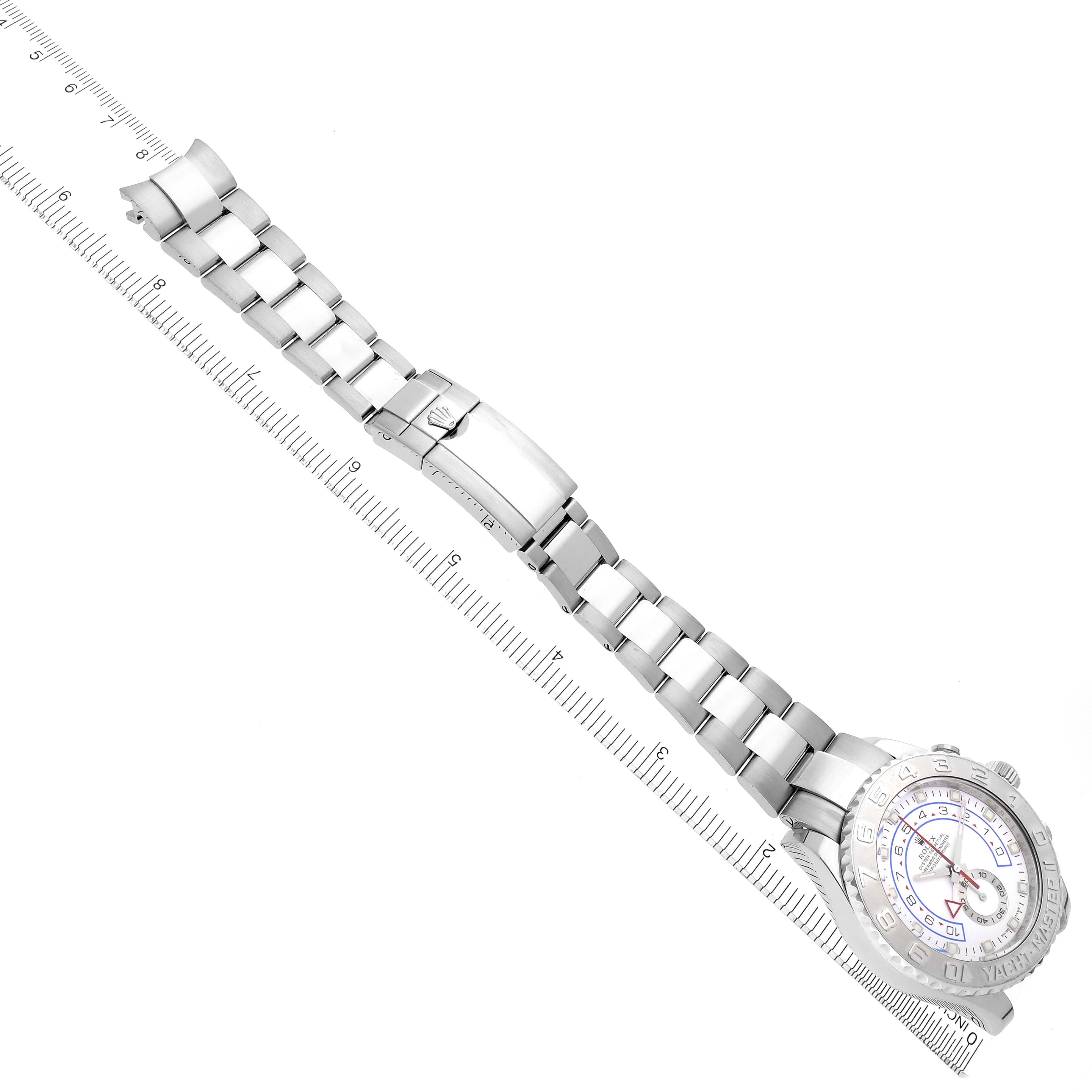 This image shows an overhead view of a Rolex Yacht-Master 116689 Men
s White Gold Silver Dial 116689 Men
s White Gold Silver Dial watch, displaying the bracelet, clasp, and partial face along a ruler for scale.