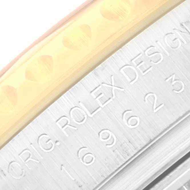 This close-up image of the Rolex Yacht-Master 169623 Women's Steel and Gold (two tone) Blue Dial 169623 Women's Steel and Gold (two tone) Blue Dial watch displays a partial view of the bezel and the engraved case back.