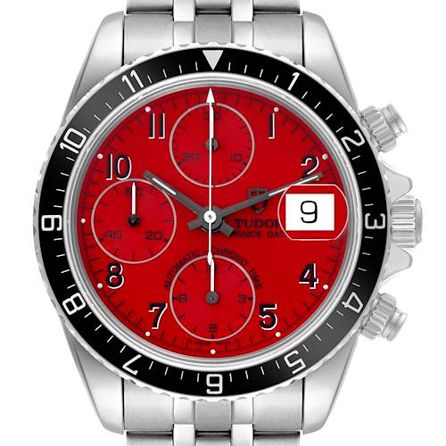 The image shows a Tudor Prince model watch from a front angle, featuring a red dial, chronograph subdials, and date window.