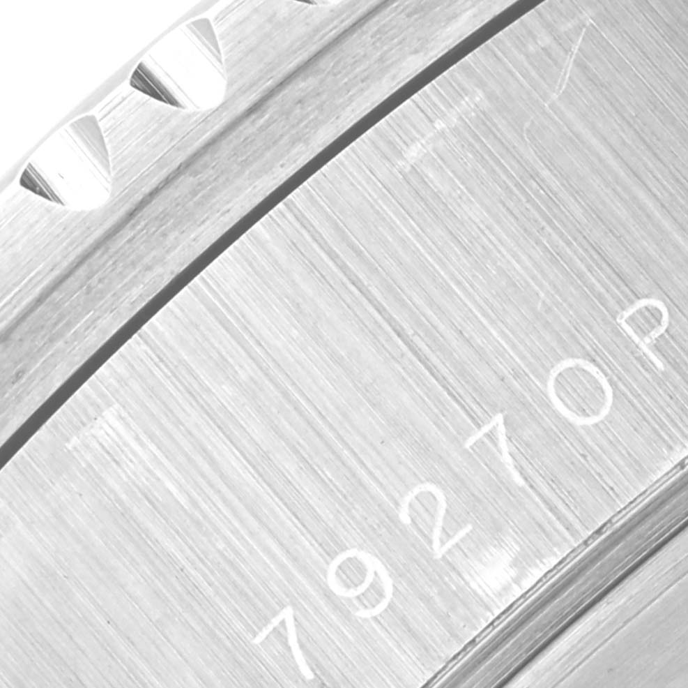 The image shows a close-up of the case back and part of the bezel of a Tudor Prince 79270 Men's Stainless Steel Red Dial 79270 Men's Stainless Steel Red Dial model watch.