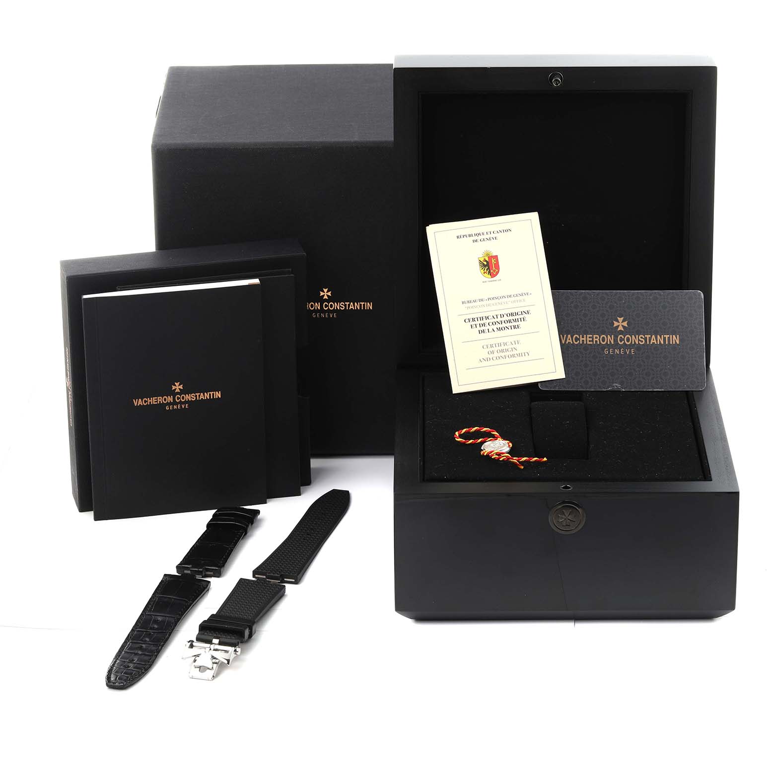 The image shows the Vacheron Constantin Overseas 5500V/110A-B481 Men's Stainless Steel Black Dial 5500V/110A-B481 Men's Stainless Steel Black Dial watch accessories, including straps, documentation, and the opened watch box at an angled view.