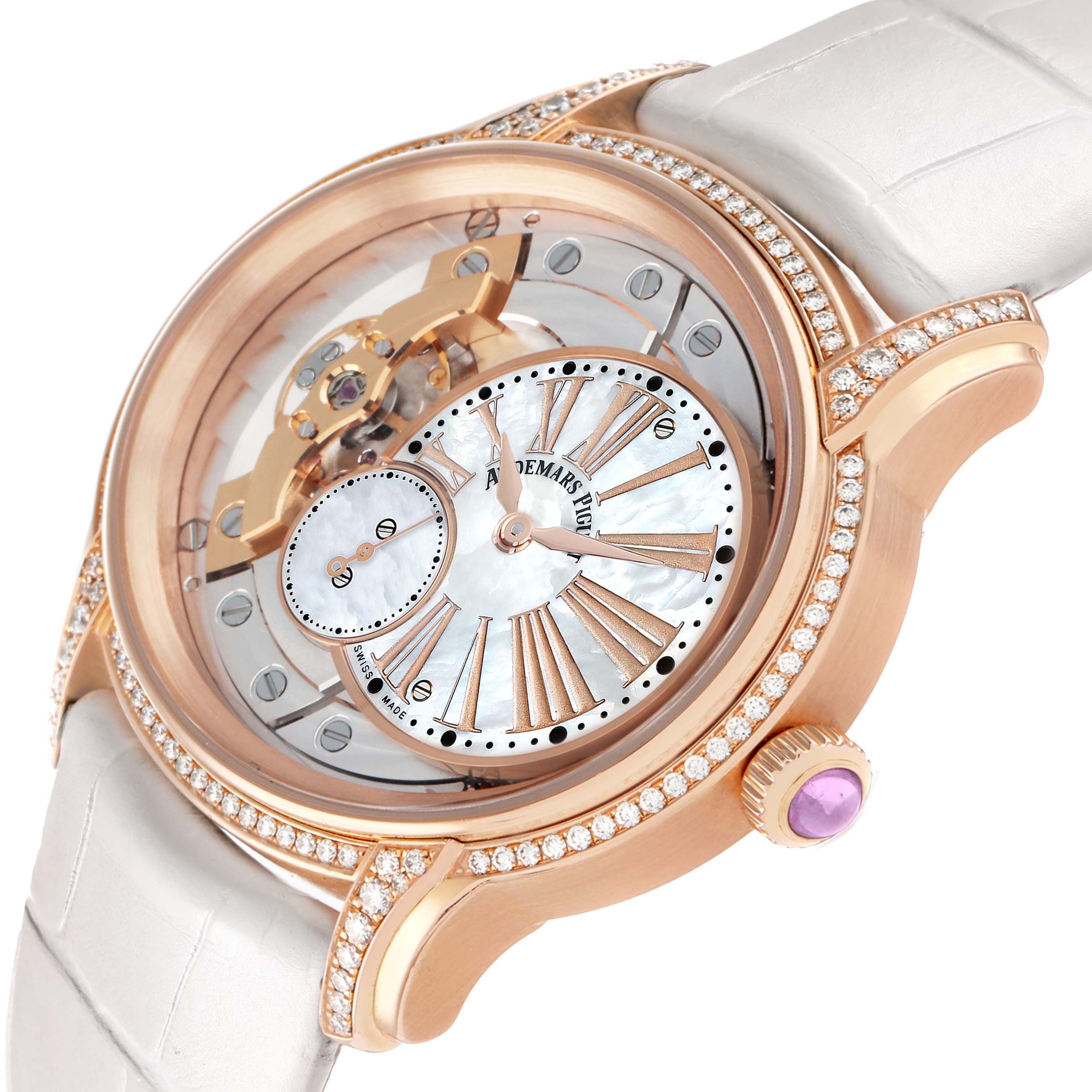 The Audemars Piguet Millenary 77247OR Women
s Rose Gold Transparent Dial watch is shown at an angle highlighting its rose gold case, open-worked dial, diamond accents, and white strap.