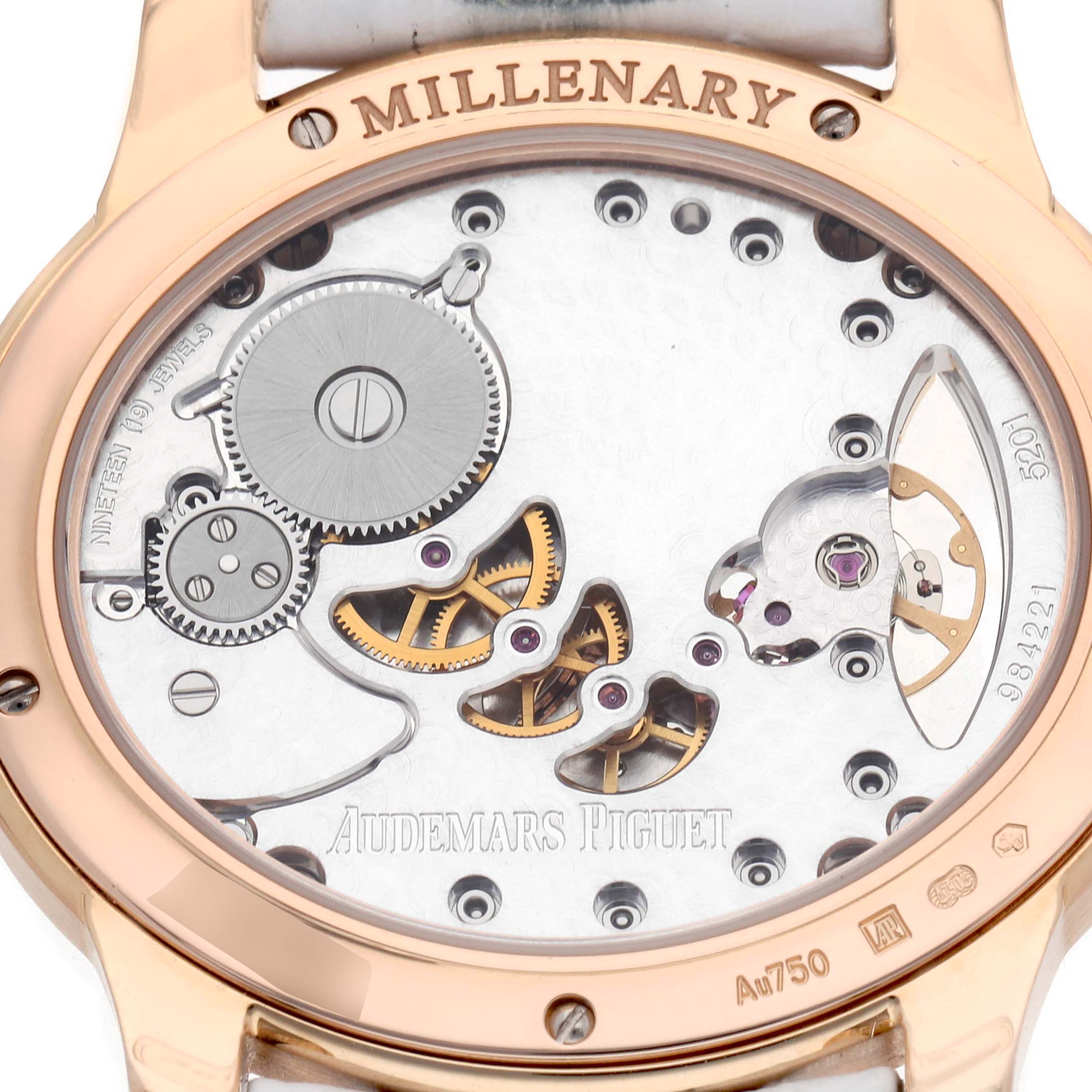 The image shows the back of the Audemars Piguet Millenary 77247OR Women
s Rose Gold Transparent Dial watch, revealing its mechanical movement and inner workings.