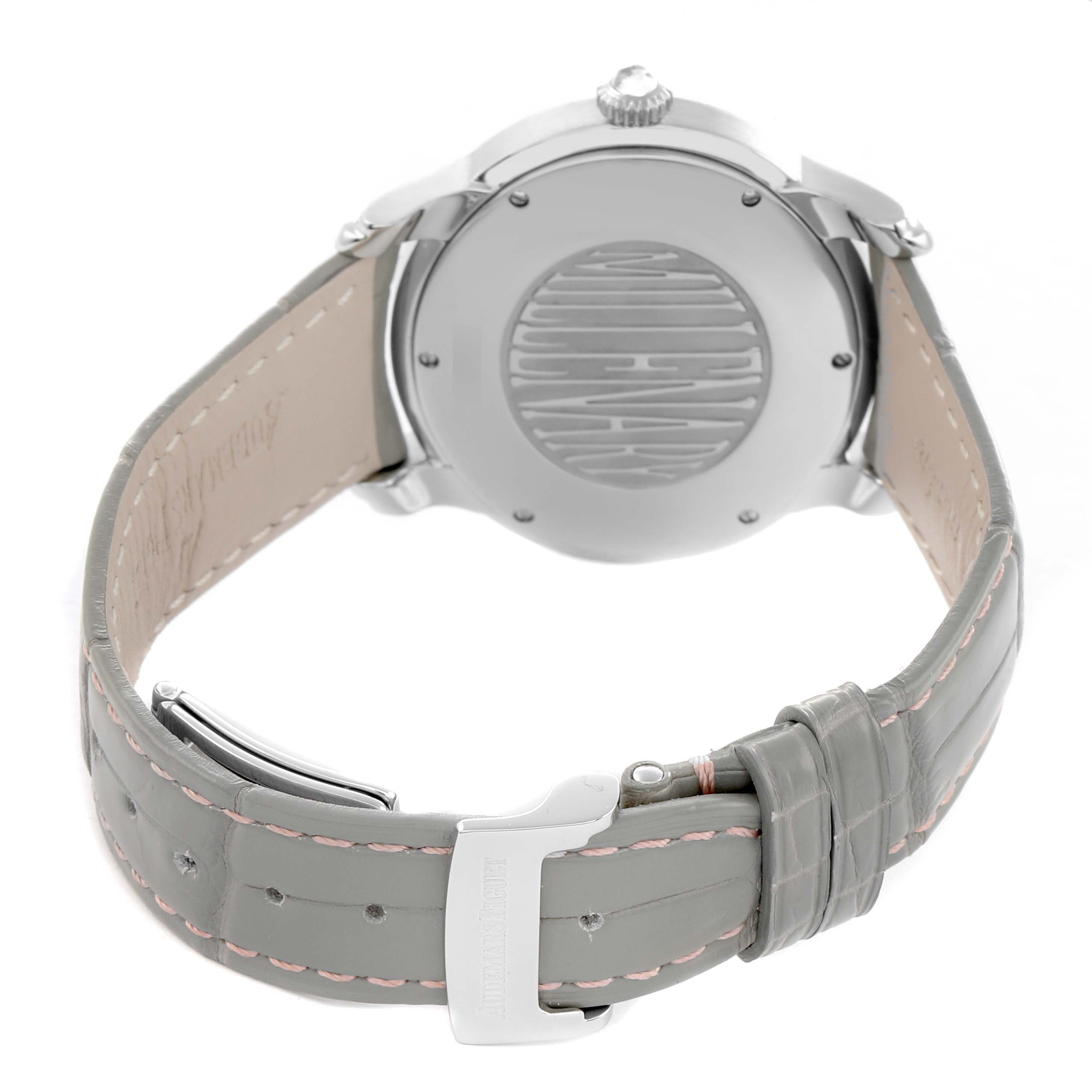 The Audemars Piguet Millenary 77301ST Women
s Stainless Steel Grey Dial watch is shown from the back, displaying the case back and the leather strap with a clasp.
