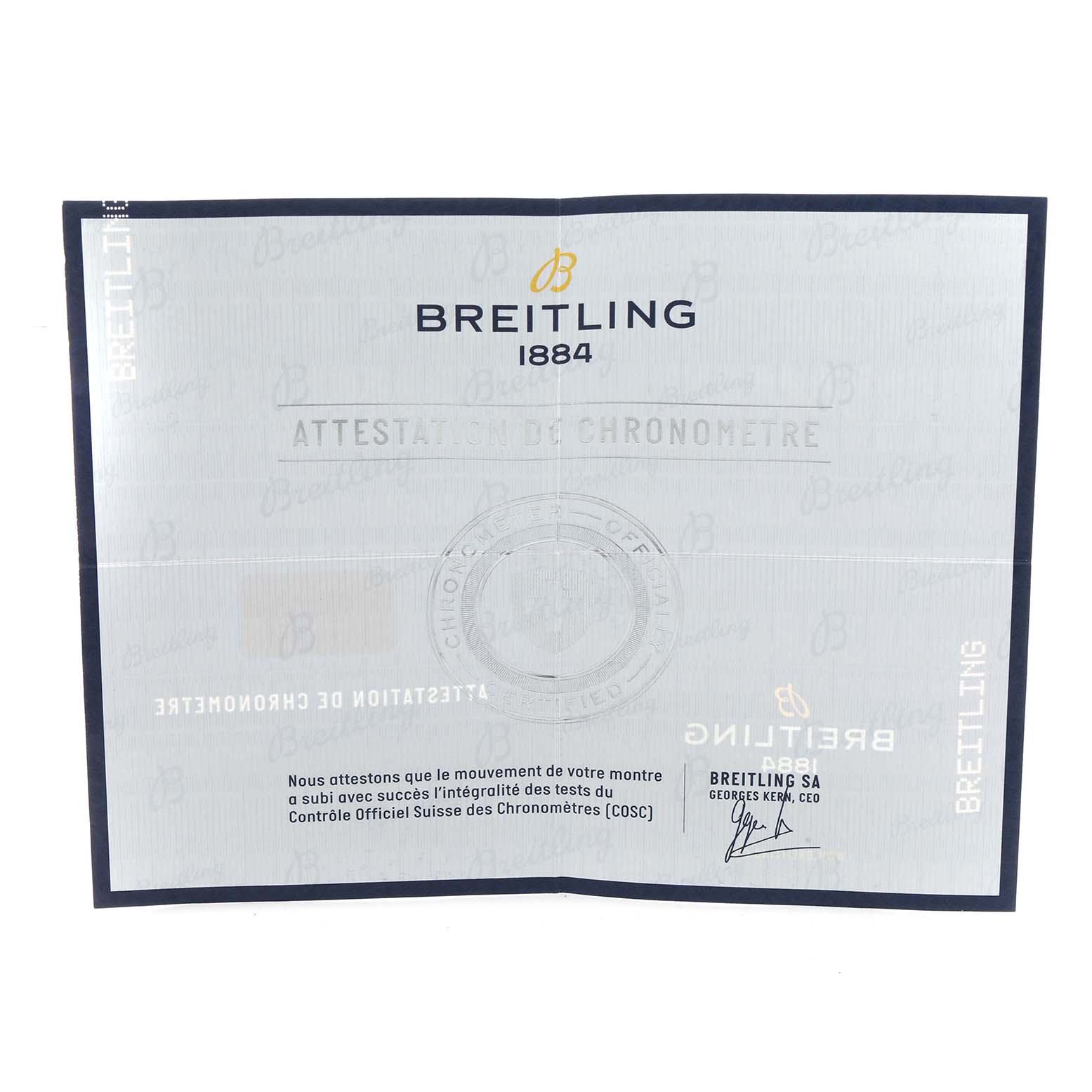 The image shows a Breitling Avenger A17318 Men
s Stainless Steel Black Dial watch
s certificate of chronometer on a flat angle.