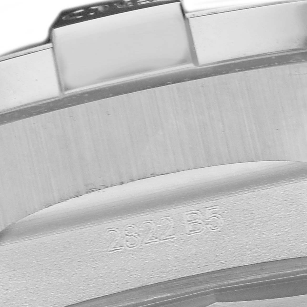 The image shows the side view of a Breitling Avenger A24315 Men
s Stainless Steel Blue Dial watch case with engraving details.