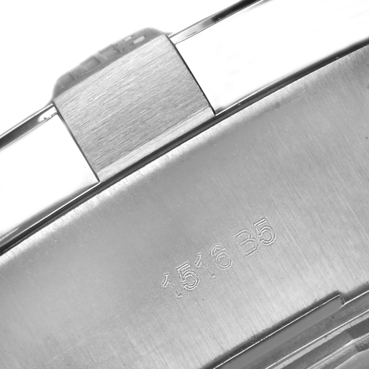 The image shows a close-up of the stainless steel clasp of a Breitling Avenger A17331 Men
s Stainless Steel Black Dial watch, displaying part of its serial number.