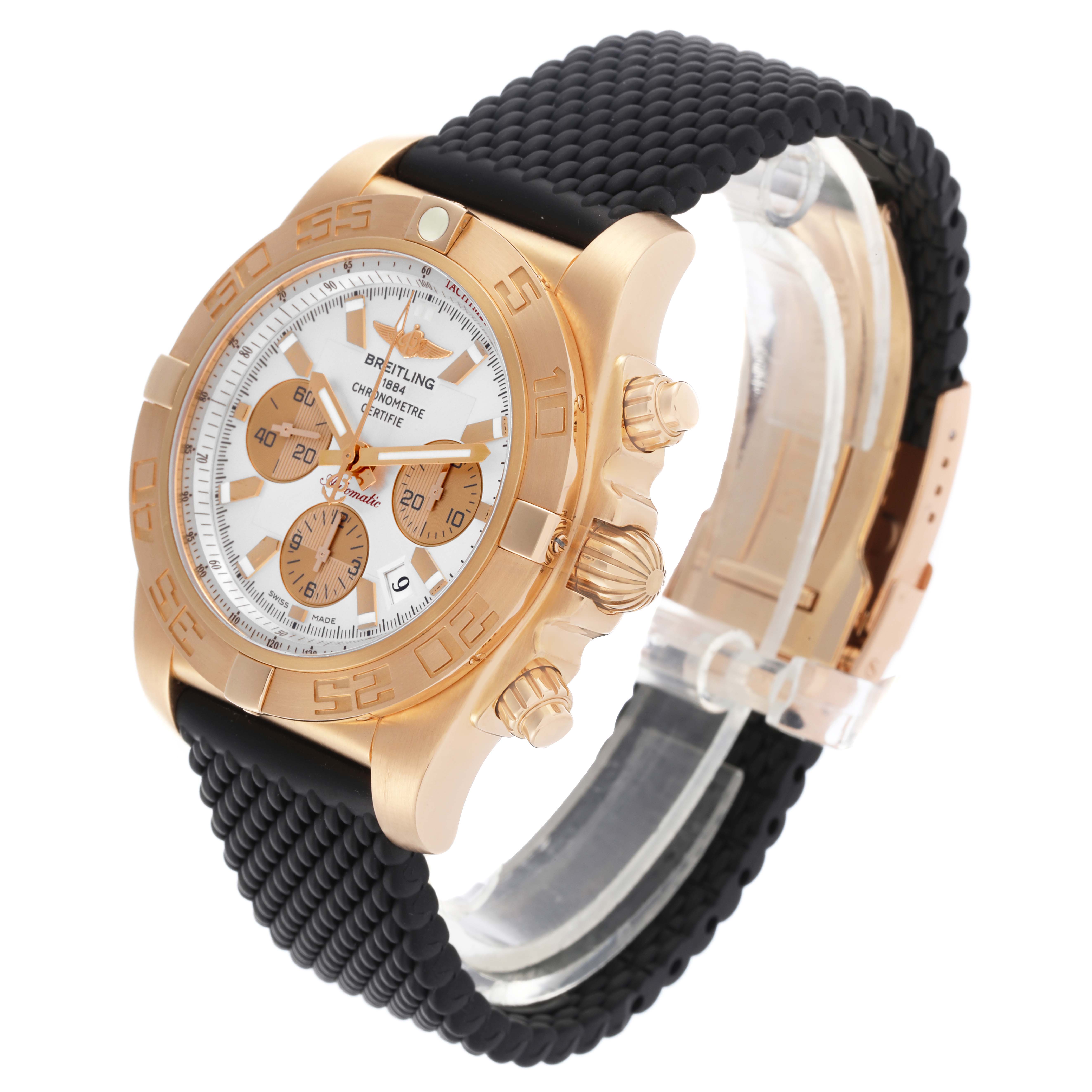 The Breitling Chronomat HB0110 Men's Rose Gold Silver Dial watch is shown at an angle highlighting its rose gold case, bezel, and black strap, with side buttons visible.