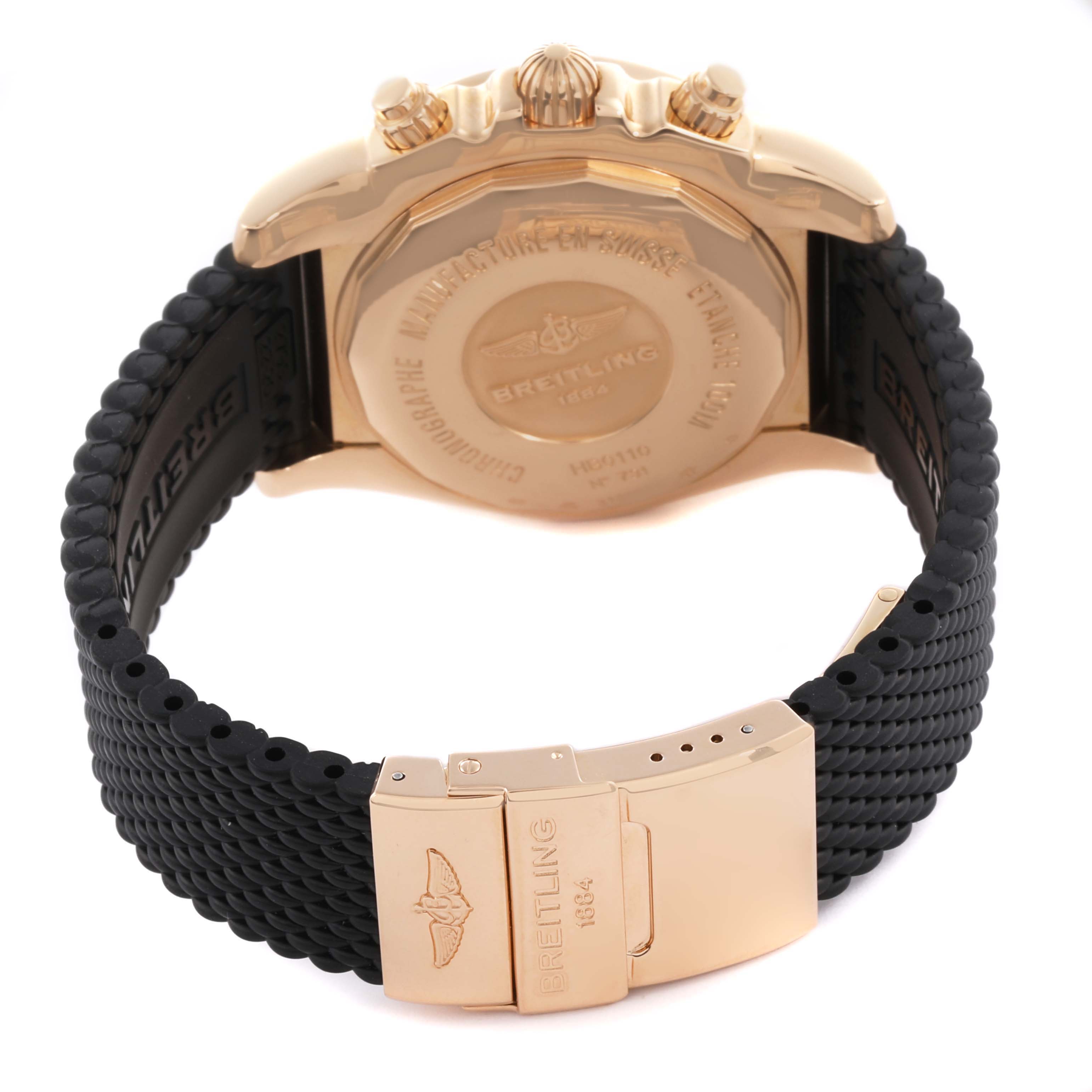 The Breitling Chronomat HB0110 Men's Rose Gold Silver Dial watch is shown from the back, highlighting the case, crown, and clasp details on the strap.