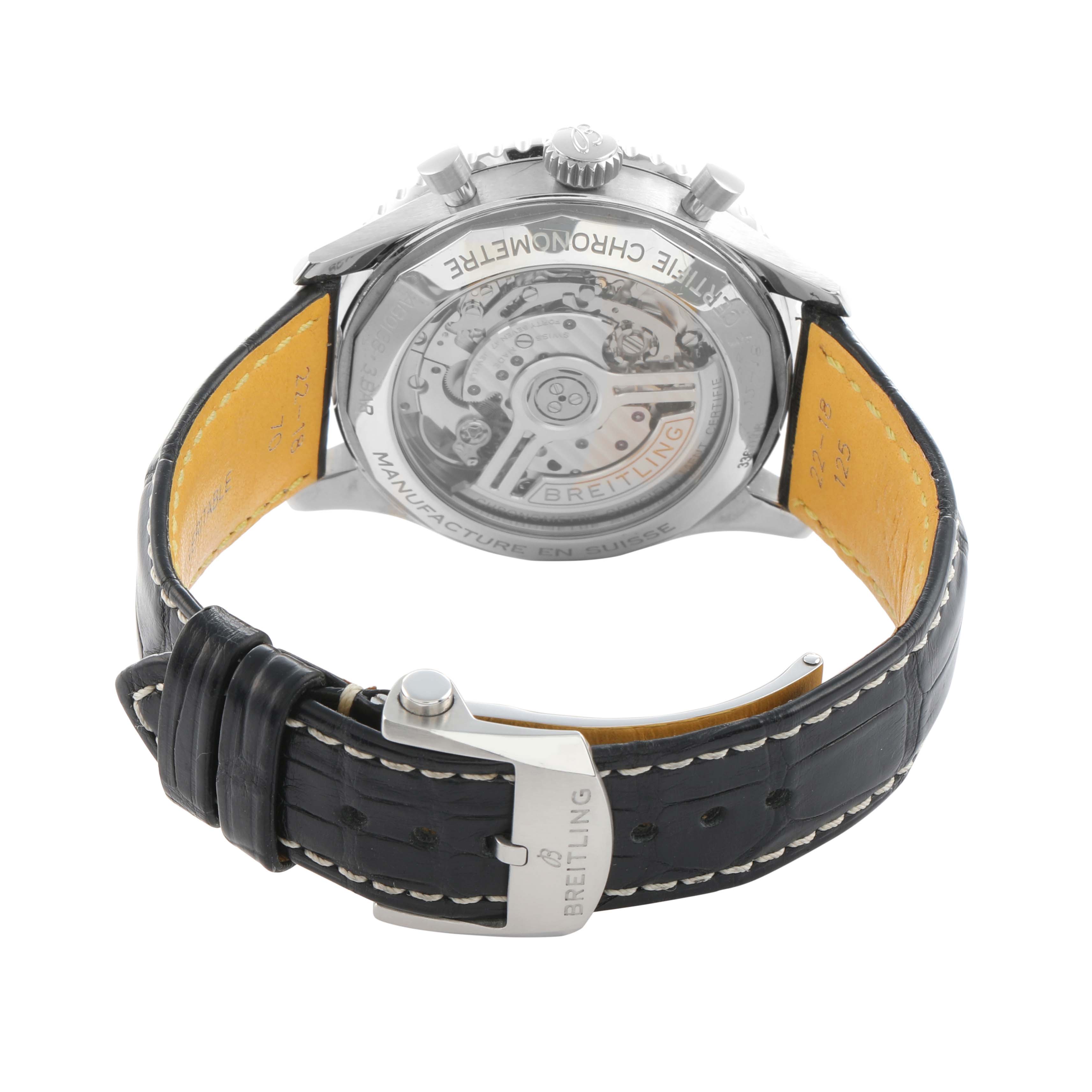 The image shows the back of a Breitling Navitimer AB0138 Men
s Stainless Steel Silver Dial watch, highlighting the transparent case back and clasp on the strap.