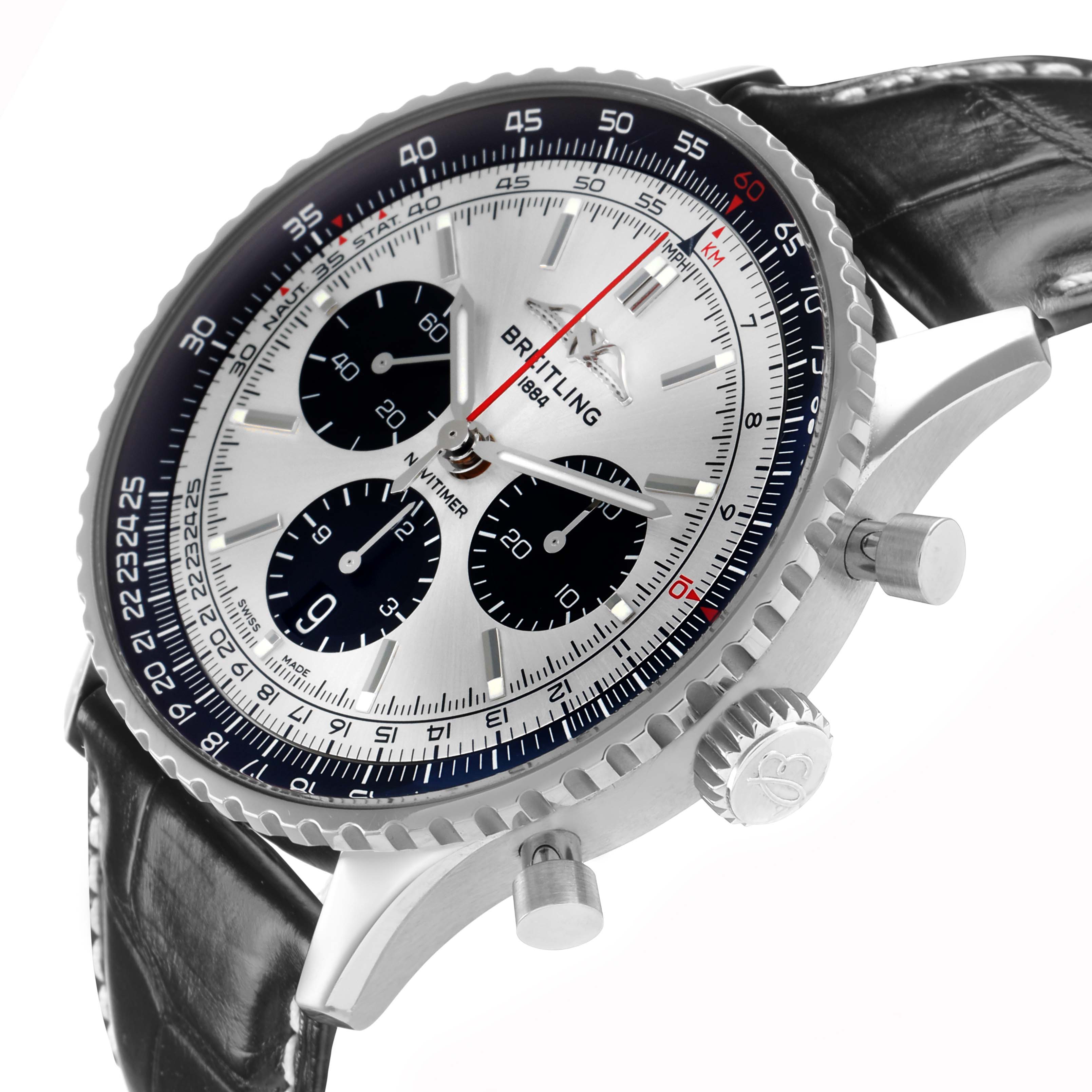 The Breitling Navitimer AB0138 Men
s Stainless Steel Silver Dial is shown from a side angle highlighting its bezel, dial, crown, pushers, and leather strap.