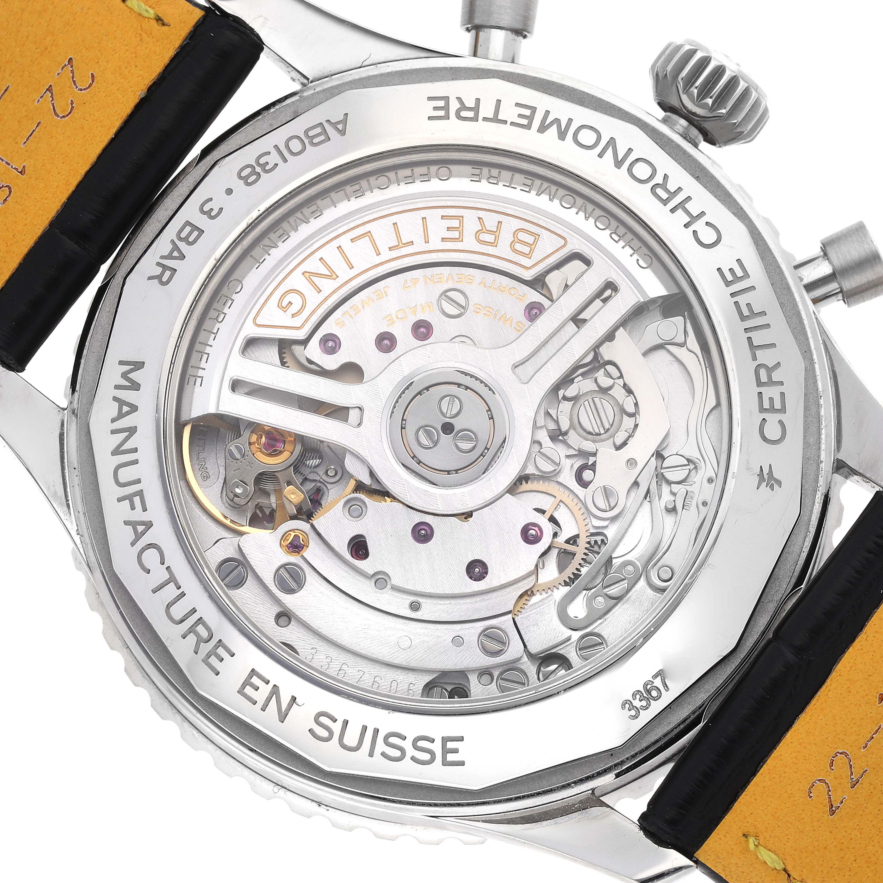 The image shows the back of a Breitling Navitimer AB0138 Men
s Stainless Steel Silver Dial watch, revealing its exposed mechanical movement and case engravings.
