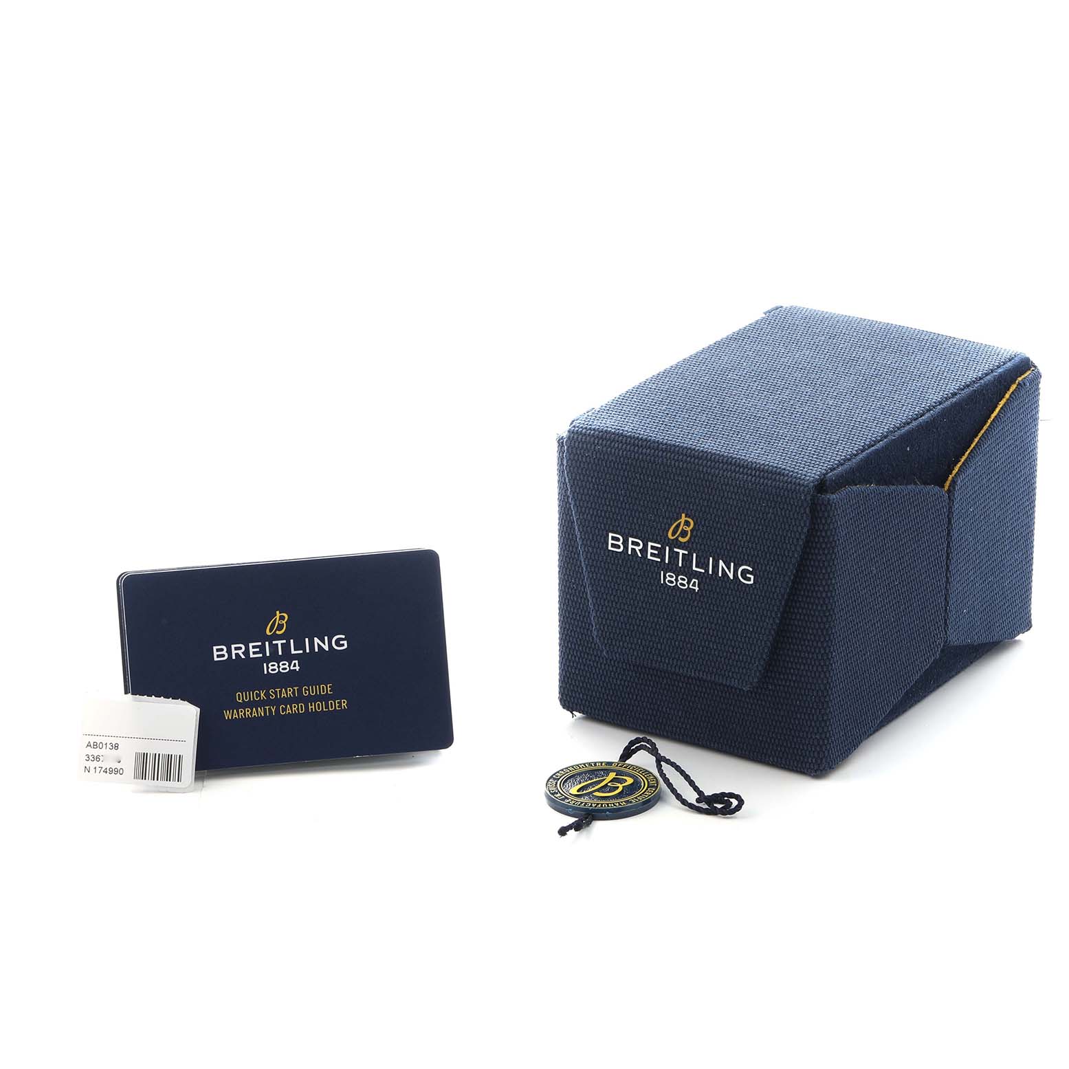 The image shows Breitling Navitimer AB0138 Men
s Stainless Steel Silver Dial accessories, including a warranty card holder, tag, and watch box.