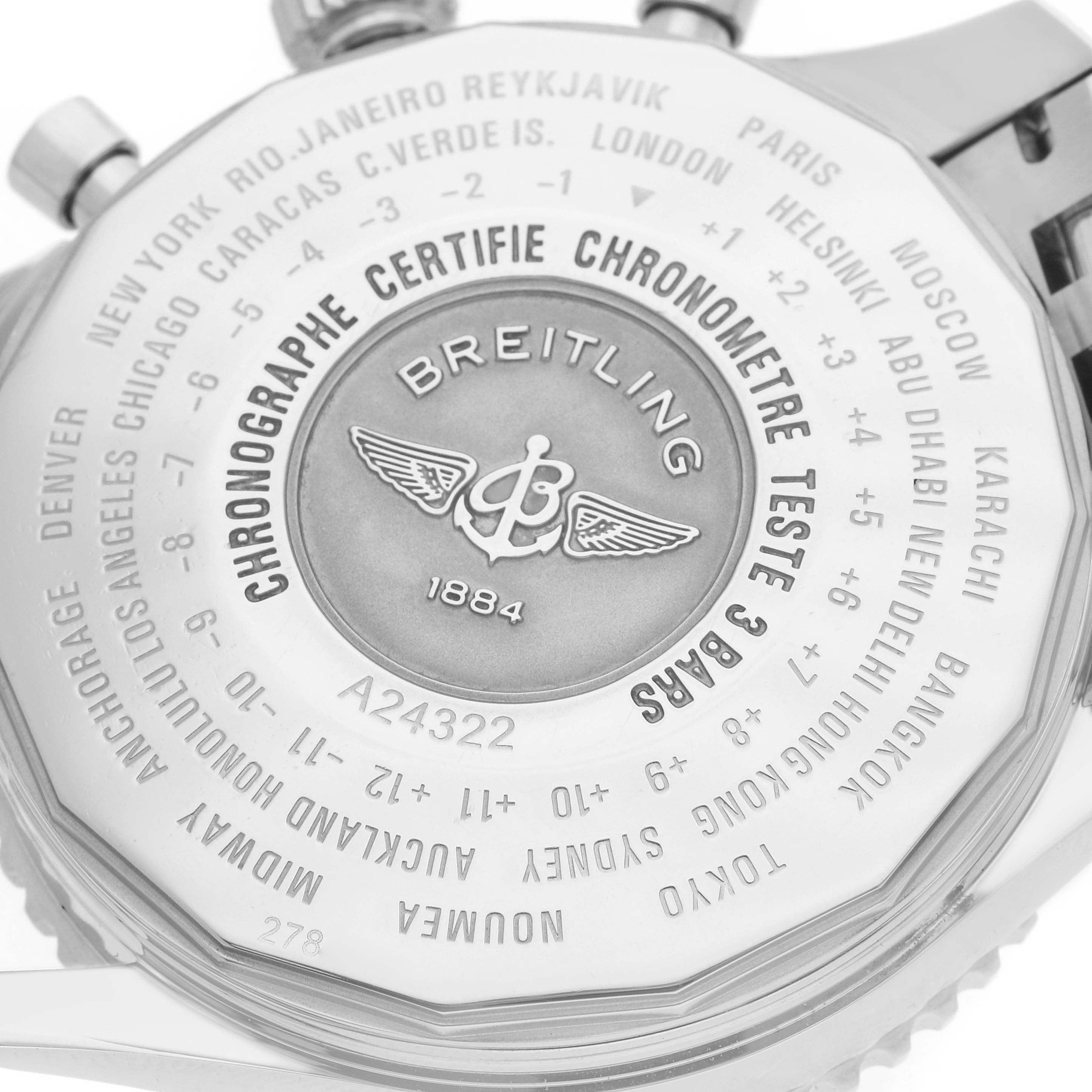 The image shows the case back of a Breitling Navitimer A24322 Men
s Stainless Steel Black Dial, highlighting city time zones and brand engravings.