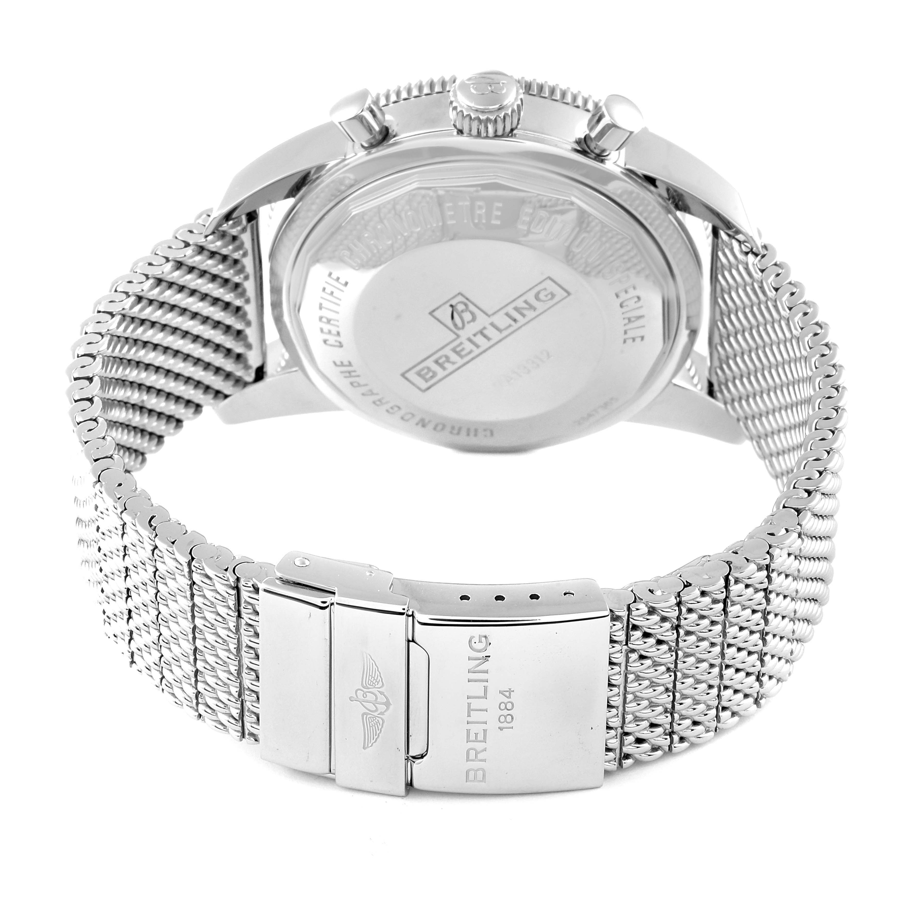 The image shows the back of the Breitling Superocean A13312 Men
s Stainless Steel Black Dial watch, highlighting the case back and mesh strap with a branded clasp.