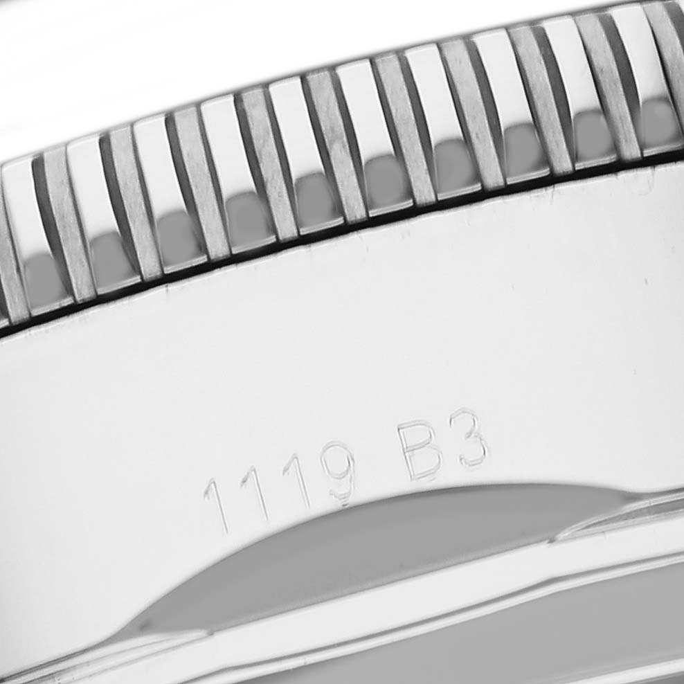 This close-up image shows the edge of the bezel and part of the case of a Breitling Superocean AB0162 Men's Stainless Steel Silver Dial AB0162 Men's Stainless Steel Silver Dial watch.