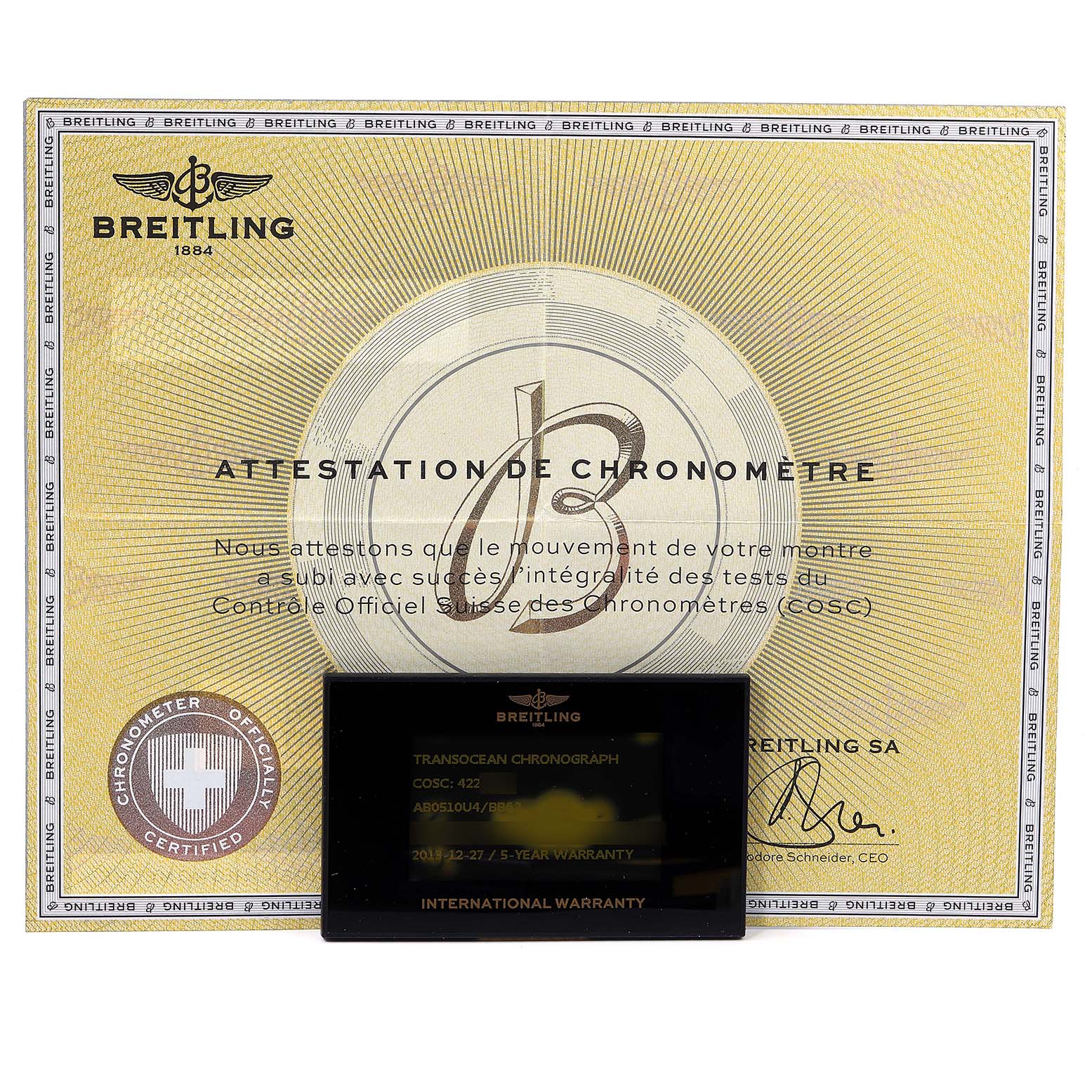 The image shows the Breitling Transocean AB0510 Men
s Stainless Steel Silver Dial AB0510 Men
s Stainless Steel Silver Dial model
s Chronometer Certificate and International Warranty card.