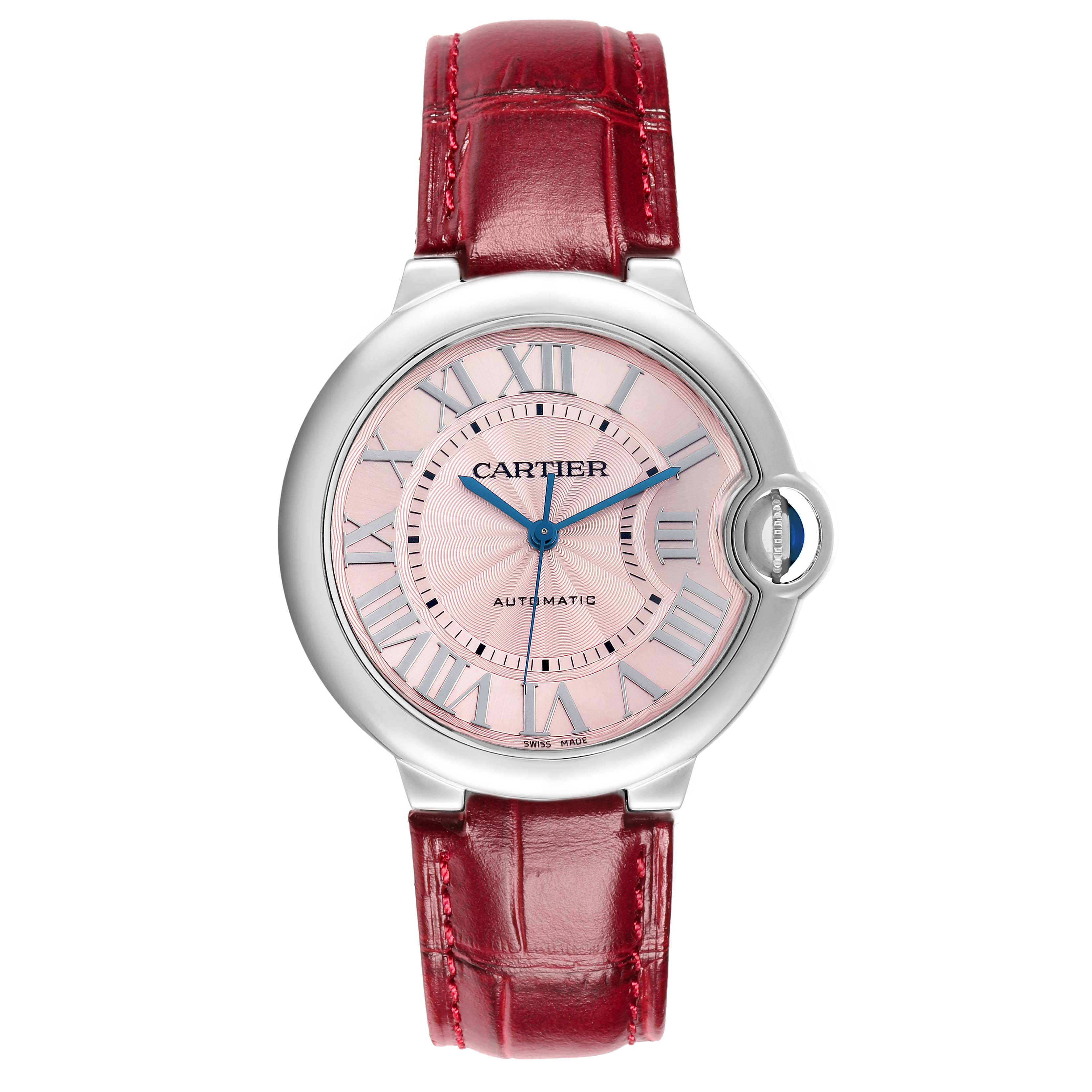 The Cartier Ballon Bleu WSBB0007 Women
s Stainless Steel Pink Dial watch is shown from a top-down angle, displaying its face, bezel, and red leather strap.