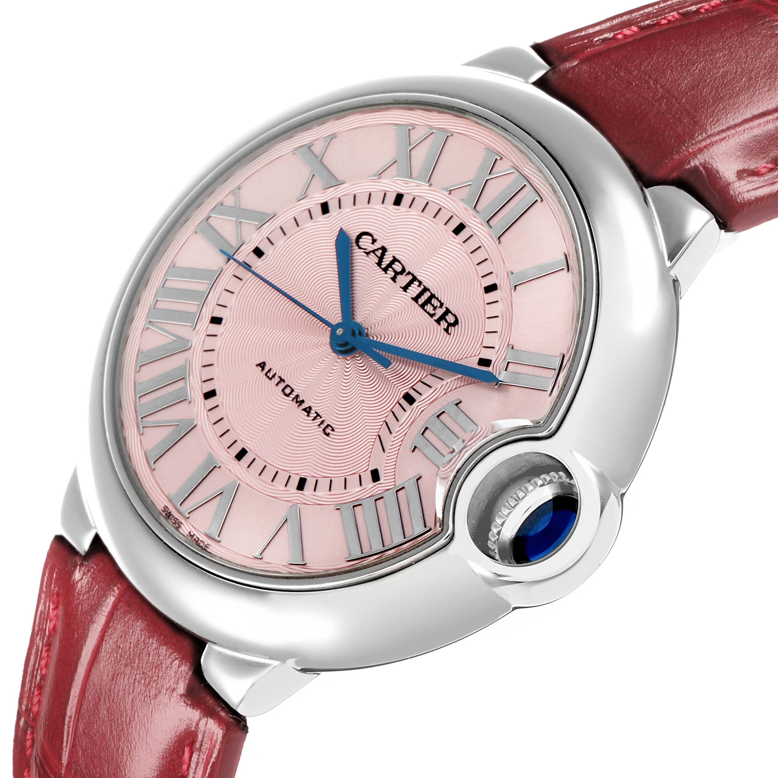 The image shows a close-up of the Cartier Ballon Bleu WSBB0007 Women
s Stainless Steel Pink Dial watch at a slight angle, highlighting the pink dial, blue hands, and crown.