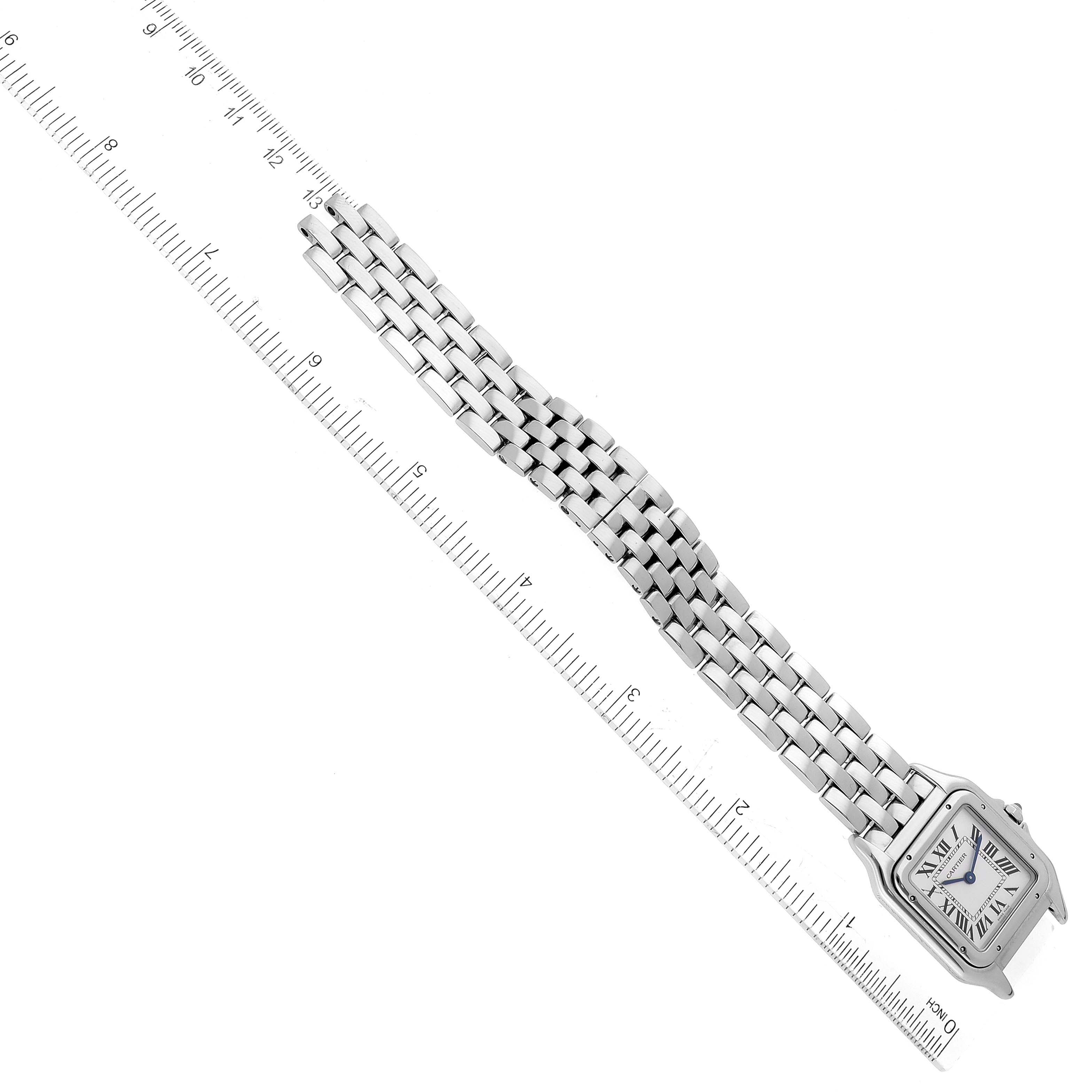 The image shows a top-down view of a Panthere de Cartier watch and its bracelet alongside a ruler.