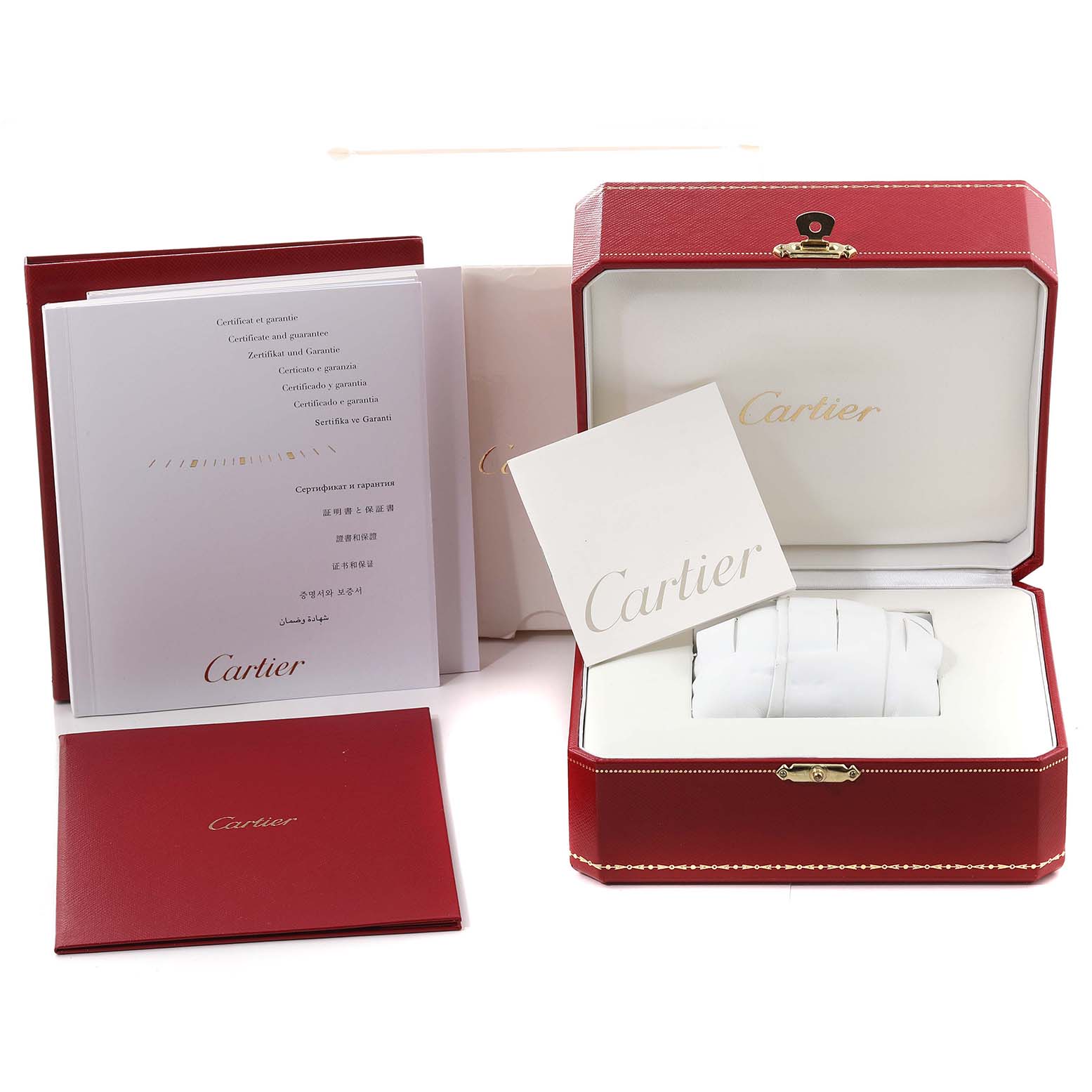 The image shows the packaging and accessories of a Cartier Tank Anglaise WT100025 Women's Steel and Gold (two tone) Silver Dial WT100025 Women's Steel and Gold (two tone) Silver Dial watch, including the box, manual, and certificates.