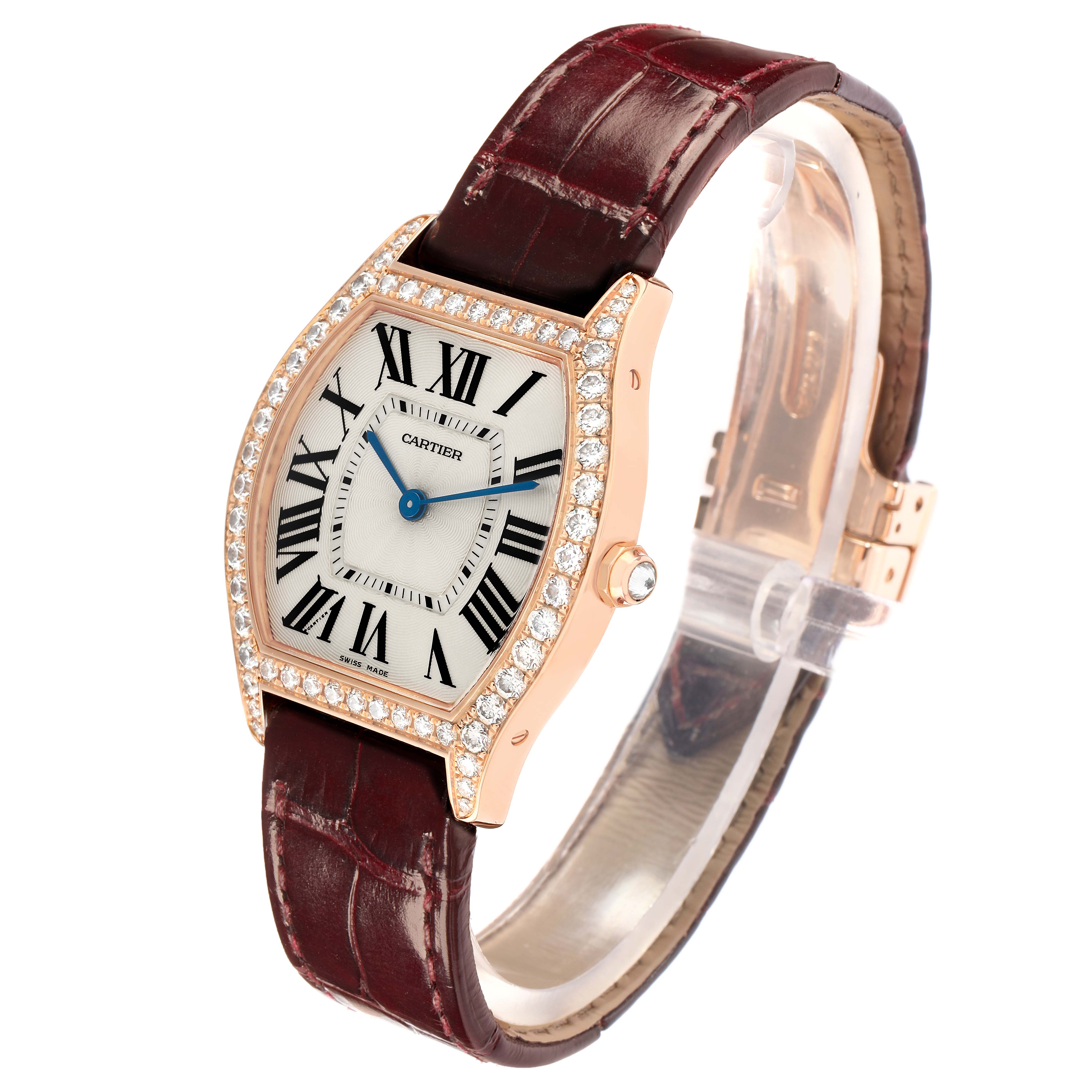 The Cartier Tortue WA501008 Women
s Rose Gold Silver Dial watch is shown at a three-quarter angle, highlighting the face, bezel, strap, and side crown.
