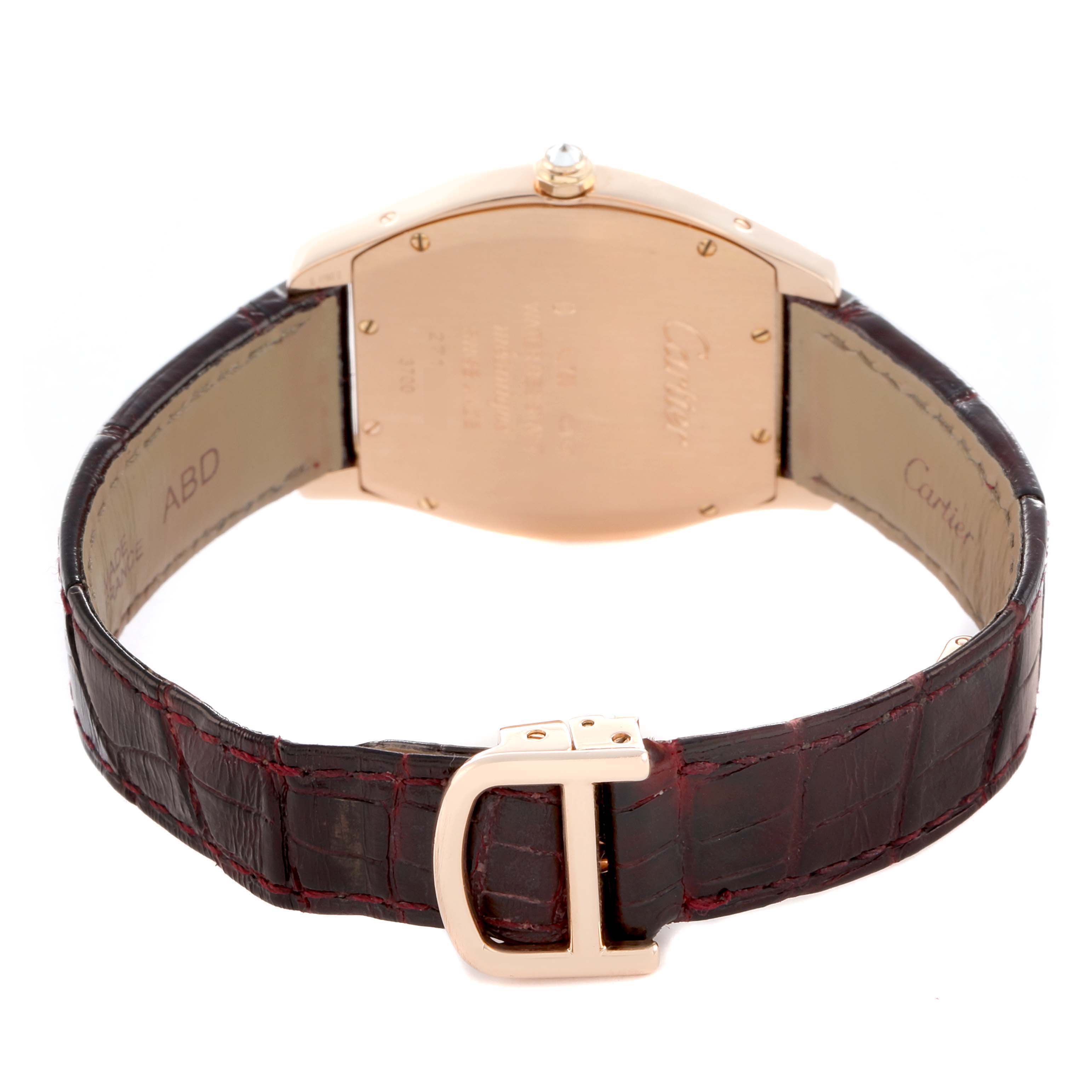 The Cartier Tortue WA501008 Women
s Rose Gold Silver Dial watch is shown from the back, highlighting the case back, brown leather strap, and clasp.