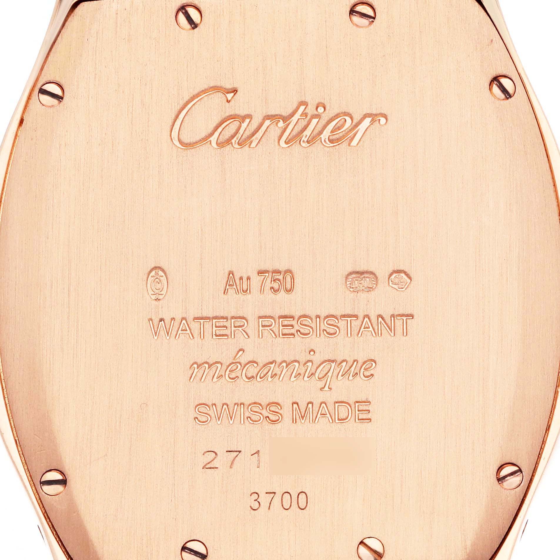 The image shows the back of a Cartier Tortue WA501008 Women
s Rose Gold Silver Dial watch, featuring engraved details and securing screws.