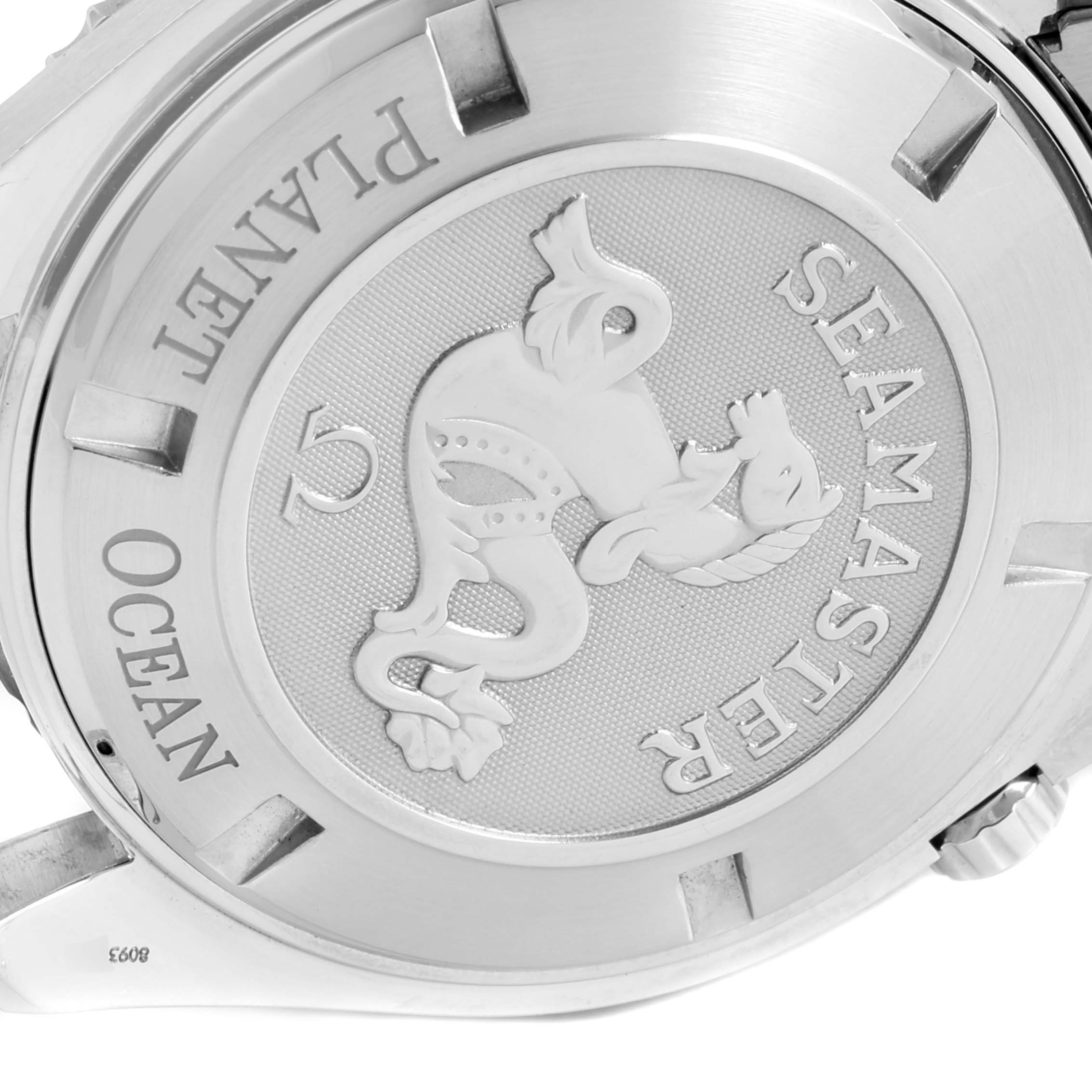 This image shows the case back of the Omega Seamaster Planet Ocean watch, featuring an embossed seahorse design.