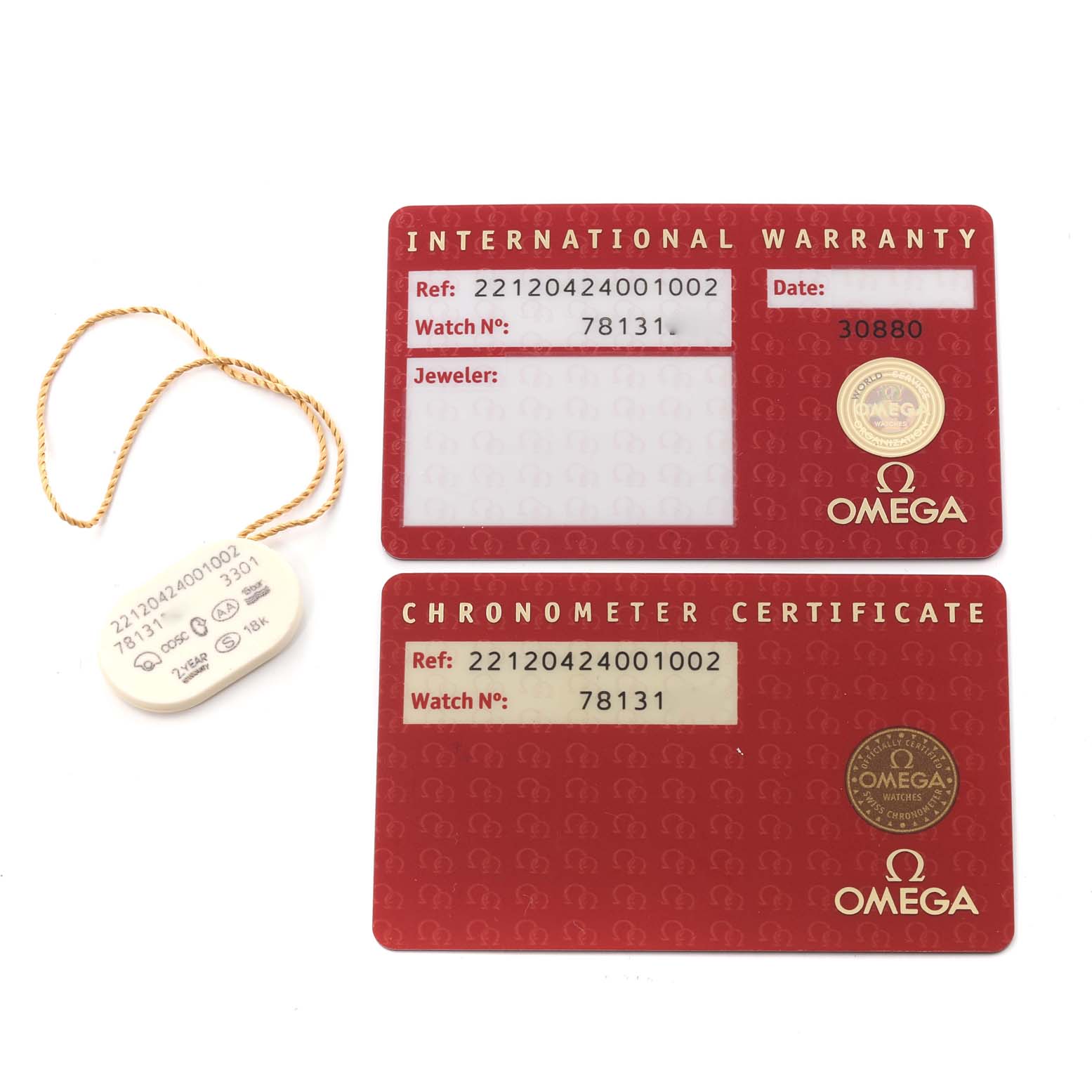 This image shows the warranty cards and tag for the Omega Aqua Terra 221.20.42.40.01.002 Men's Steel and Gold (two tone) Black Dial 221.20.42.40.01.002 Men's Steel and Gold (two tone) Black Dial model from a top-down angle.