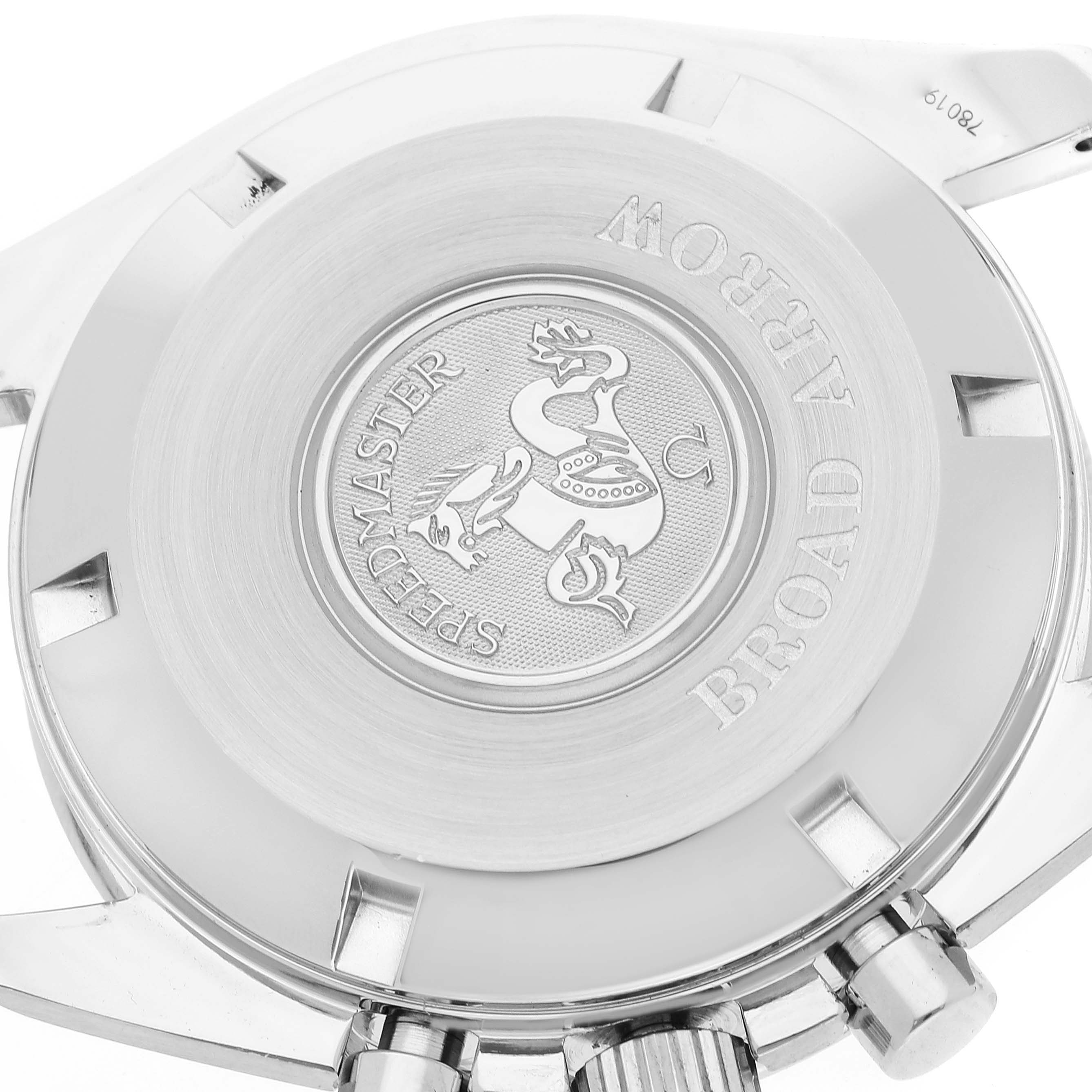 The image shows the caseback and crown of an Omega Speedmaster 3551.20.00 Men's Stainless Steel Yellow Dial 3551.20.00 Men's Stainless Steel Yellow Dial Broad Arrow watch, highlighting its engravings and buttons.