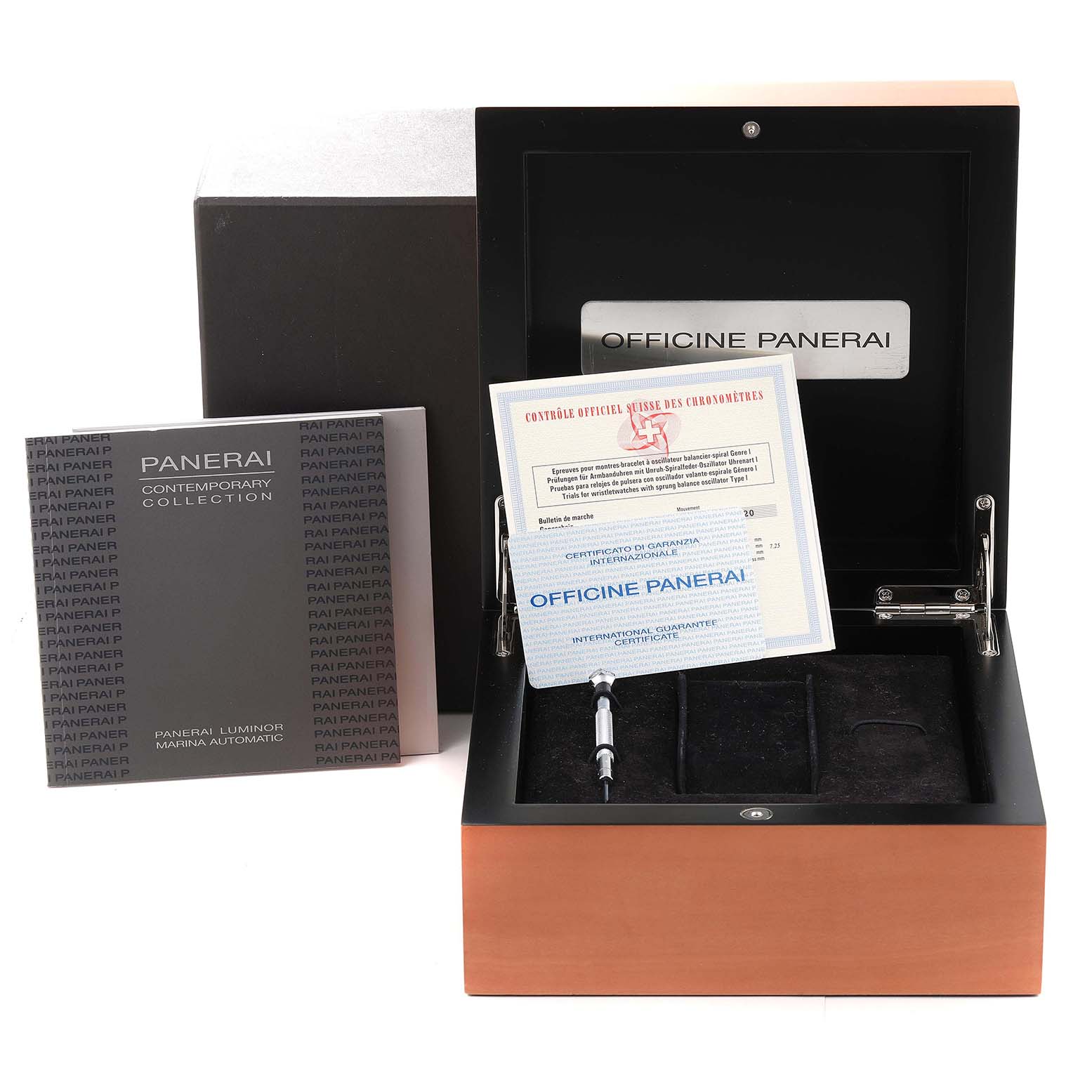 The image shows a Luminor model by Panerai with its open box, documentation, and accessories including a tool.
