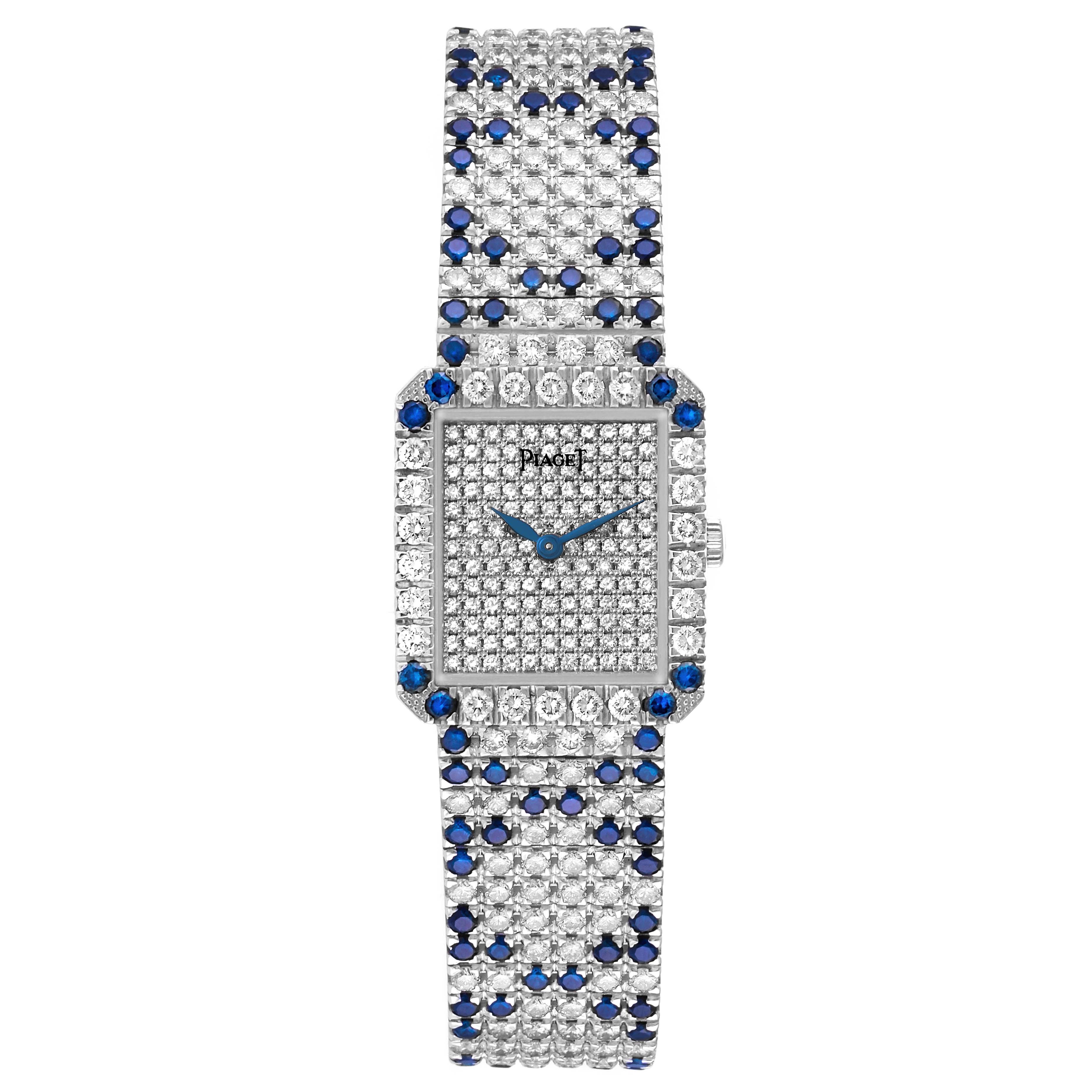 The image shows a top-down view of the Piaget 83541 C630 Women's White Gold Silver Dial 83541 C630 Women's White Gold Silver Dial Protocole Exceptional 83541 model, highlighting its diamond and sapphire-encrusted case and bracelet.