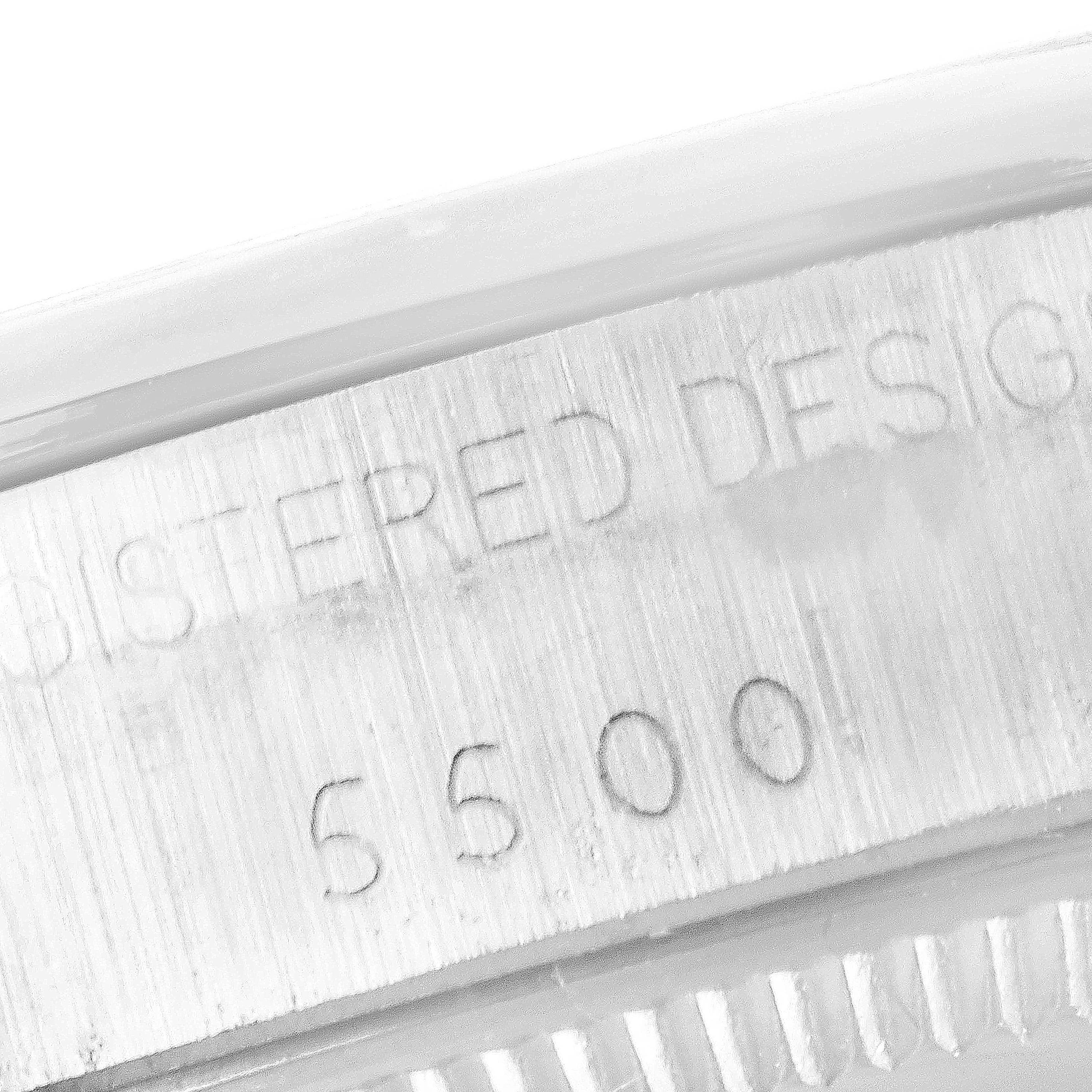 This image shows a close-up of the case edge with engraved details on a Rolex Vintage Collection 5500 Men's Stainless Steel Silver Dial 5500 Men's Stainless Steel Silver Dial watch.