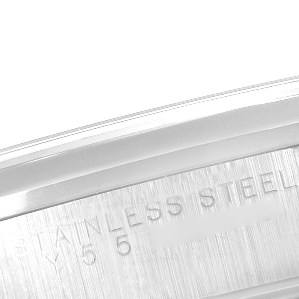 The image shows a close-up of the side engraving on a Rolex Date 15200 Men's Stainless Steel Blue Dial 15200 Men's Stainless Steel Blue Dial model watch, focusing on the "STAINLESS STEEL" text.