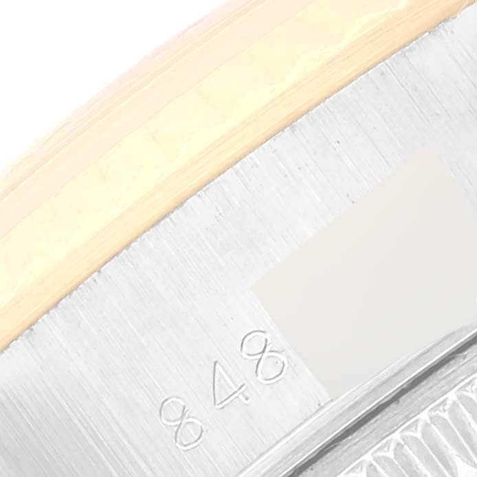 This image shows a close-up of the bezel and casing of a Rolex Date 69173 Women's Steel and Gold (two tone) Silver Dial 69173 Women's Steel and Gold (two tone) Silver Dial model watch.