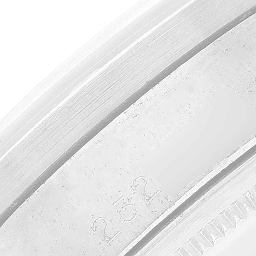 This is a close-up angle of the side and back of the Rolex Vintage Collection 1501 Men
s Stainless Steel Silver Dial 1501 Men
s Stainless Steel Silver Dial model, highlighting the edge and engraved serial number.