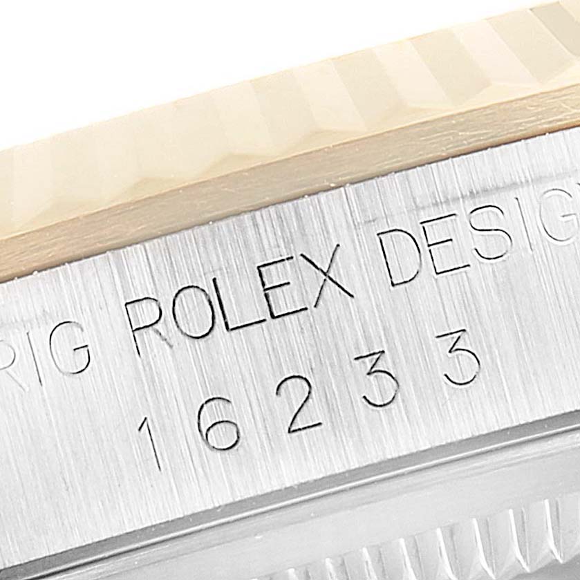 This close-up of the Rolex Datejust 16233 Men's Steel and Gold (two tone) Black Dial 16233 Men's Steel and Gold (two tone) Black Dial watch shows the engraved model number "16233" on the case, beneath the bezel.