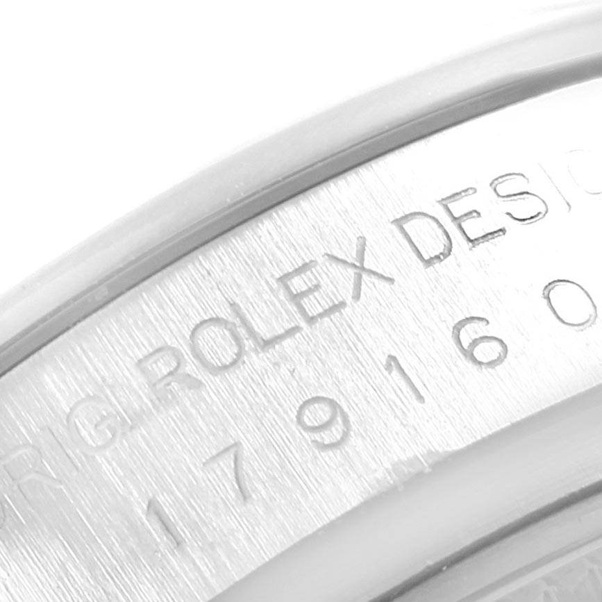 This close-up image shows the engraved text on the side of a Rolex Datejust 179160 Women's Stainless Steel Silver Dial 179160 Women's Stainless Steel Silver Dial watch case.