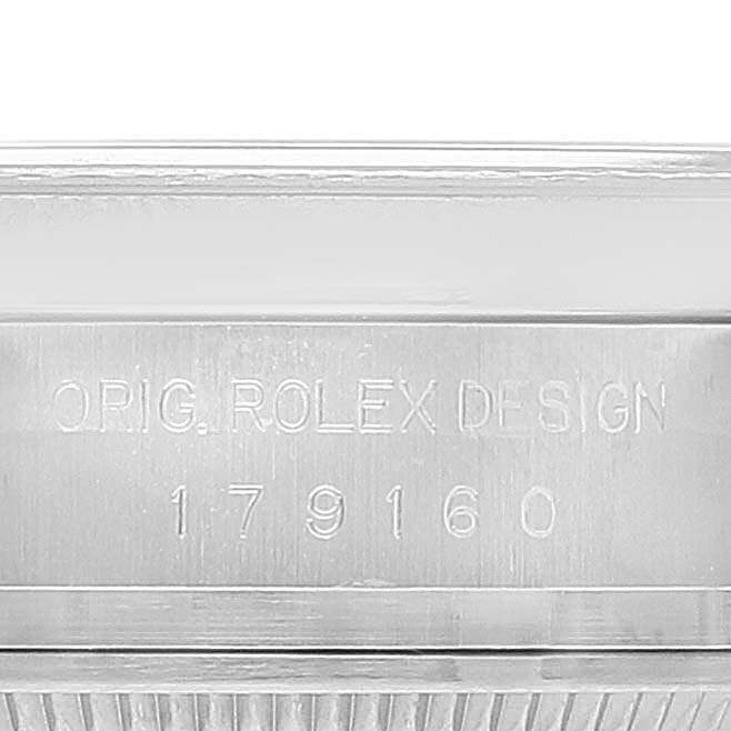 The image shows a close-up of the engraved serial number and "Orig. Rolex Design" on a Rolex Datejust 179160 Women's Stainless Steel Silver Dial 179160 Women's Stainless Steel Silver Dial watch case.