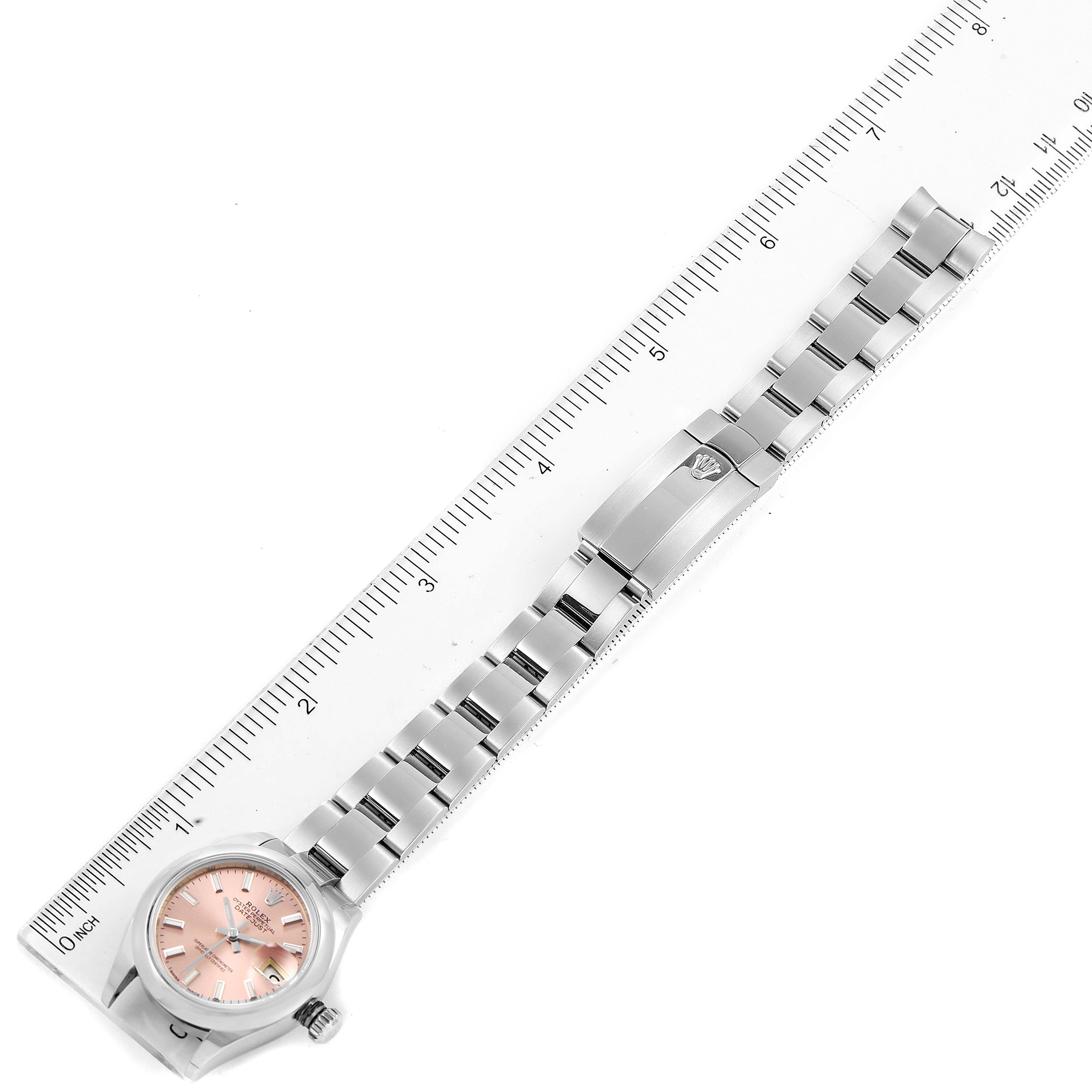 The image shows a Rolex Datejust 279160 Women's Stainless Steel Pink Dial 279160 Women's Stainless Steel Pink Dial watch horizontally, alongside a ruler for size reference, highlighting the band and face.