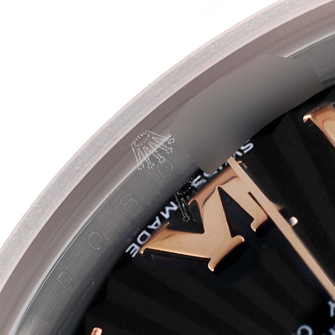 The image shows a close-up of the dial and inner bezel, featuring part of the "M" marker on the Rolex Datejust 178241 Women's Steel and Gold (two tone) Black Dial 178241 Women's Steel and Gold (two tone) Black Dial watch.