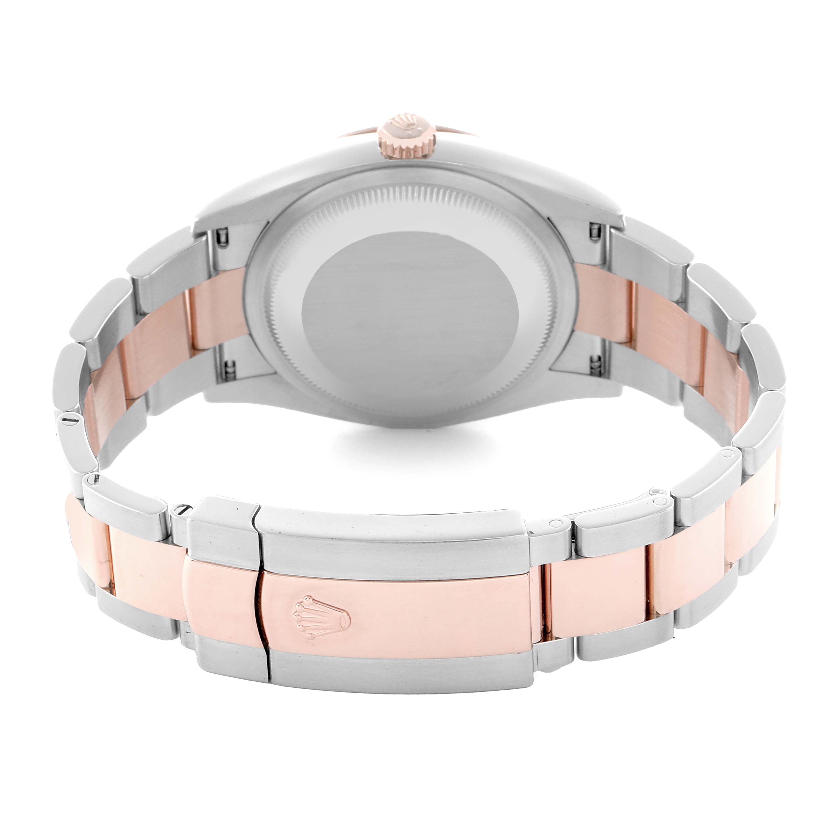 The image shows the back view of a Rolex Datejust 126201 Men
s Steel and Gold (two tone) Black Dial, highlighting the clasp, bracelet, and case back.