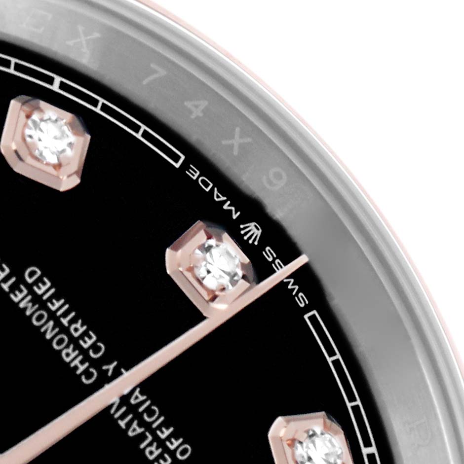 The image shows a close-up of the Rolex Datejust 126201 Men
s Steel and Gold (two tone) Black Dial watch face, highlighting the hour markers and part of the dial.