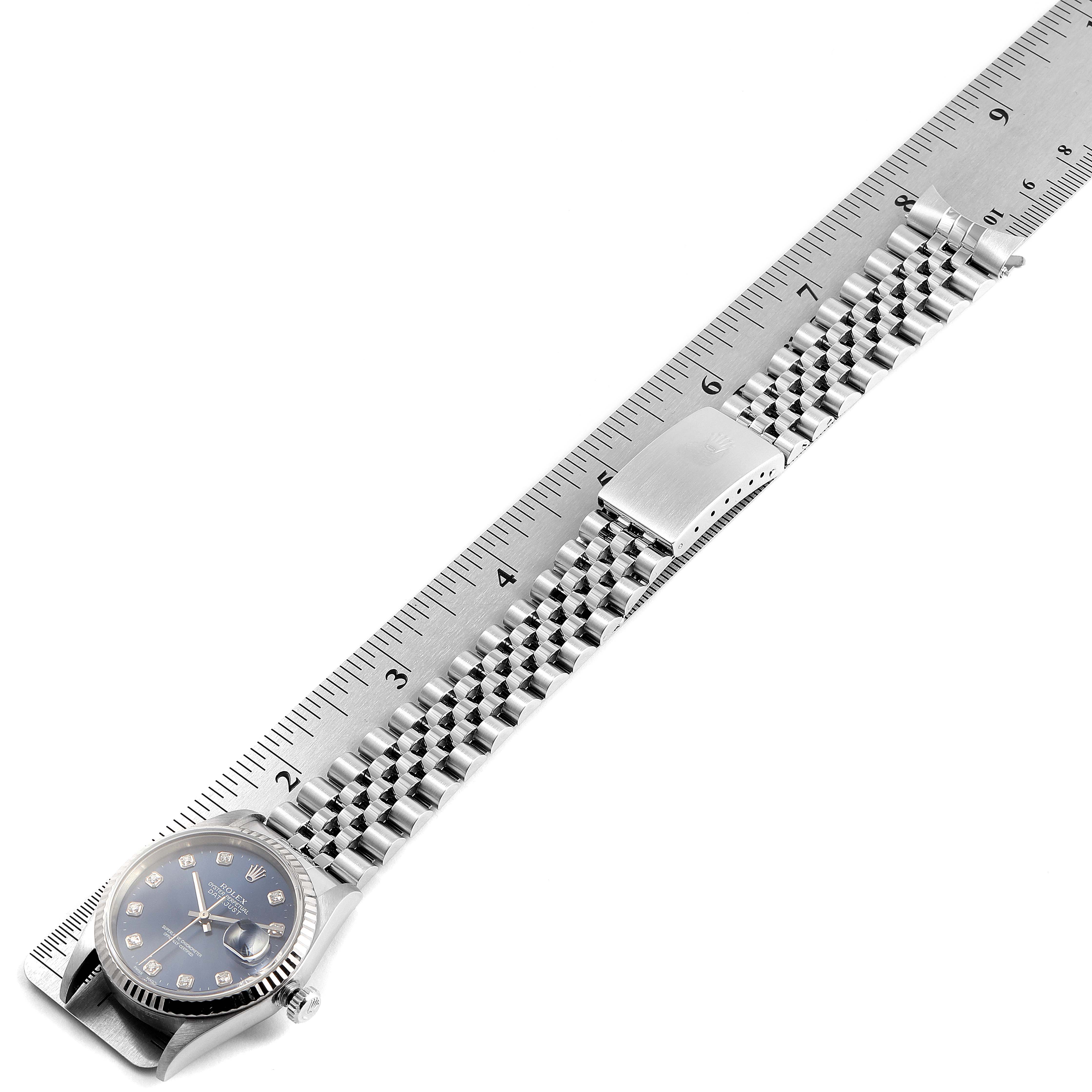The image shows a Rolex Datejust 16234 Men's Stainless Steel Blue Dial 16234 Men's Stainless Steel Blue Dial watch with the face, bracelet, and clasp aligned next to a ruler for measurement.