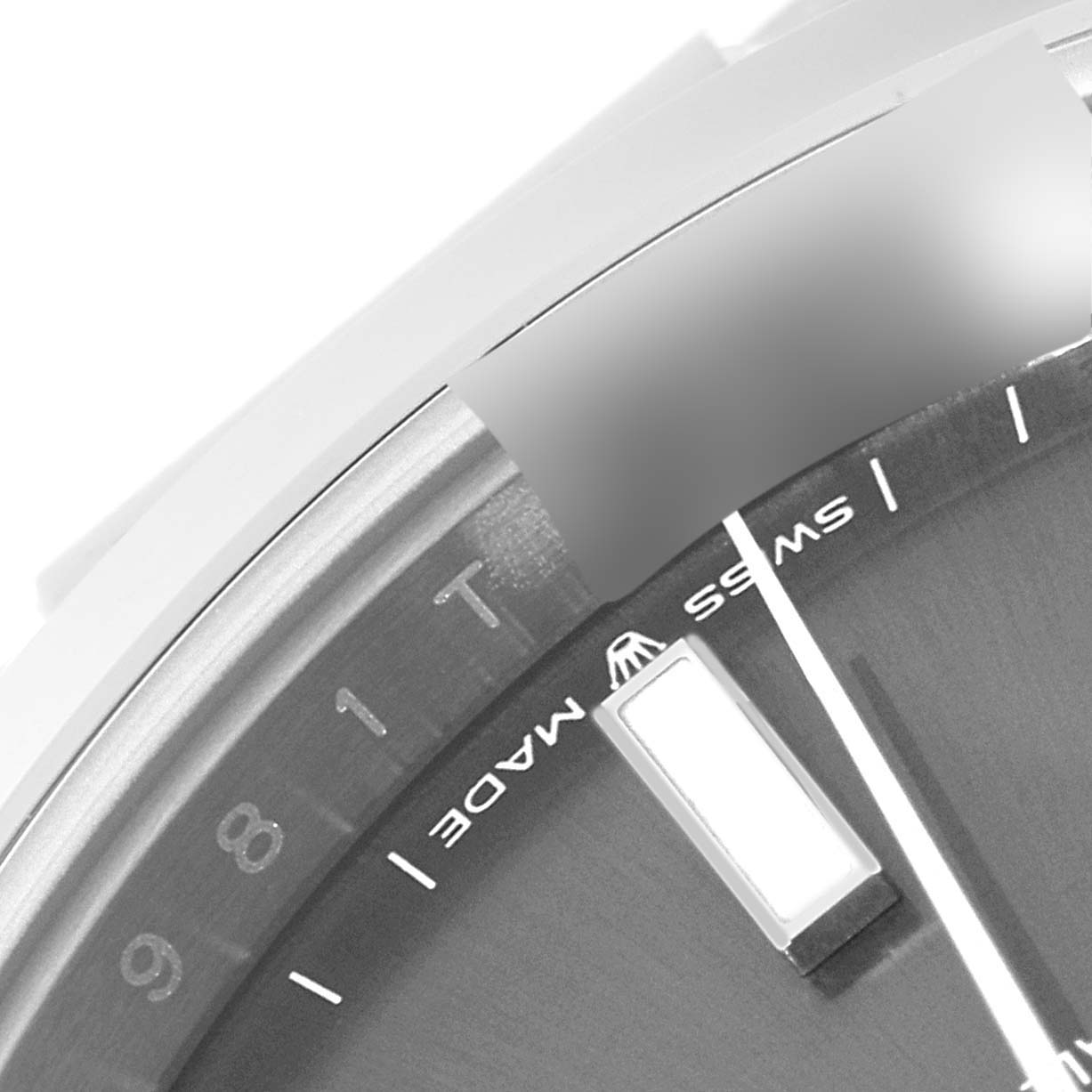 The image shows a close-up of the dial and partial bezel of the Rolex Datejust 41 126300 Men
s Stainless Steel Grey Dial 126300 Men
s Stainless Steel Grey Dial, focusing on the "Swiss Made" label and some hour markers.