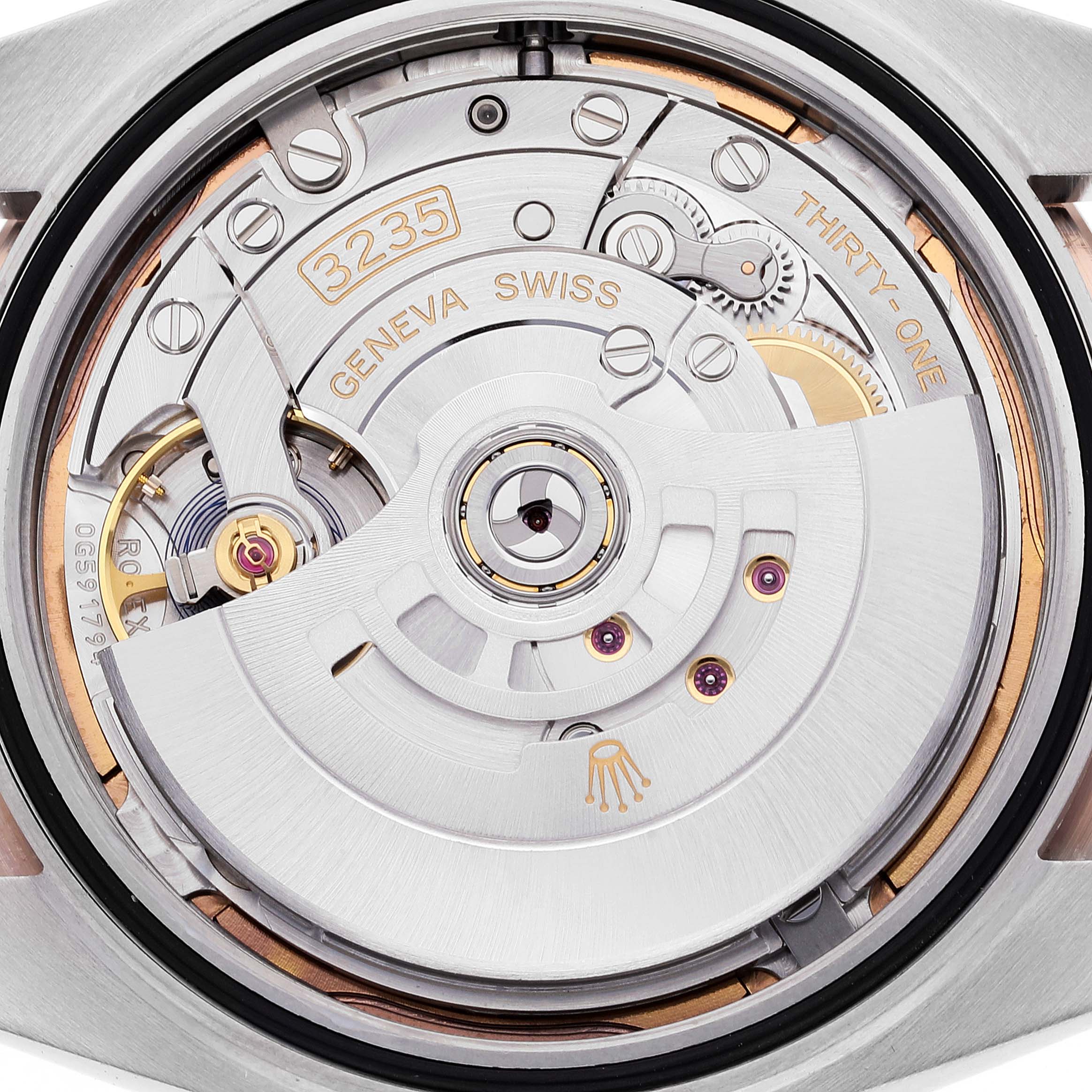 The image shows a close-up view of the movement and intricate internal components of the Rolex Datejust 41 126331 Men's Steel and Gold (two tone) Brown Dial 126331 Men's Steel and Gold (two tone) Brown Dial model.