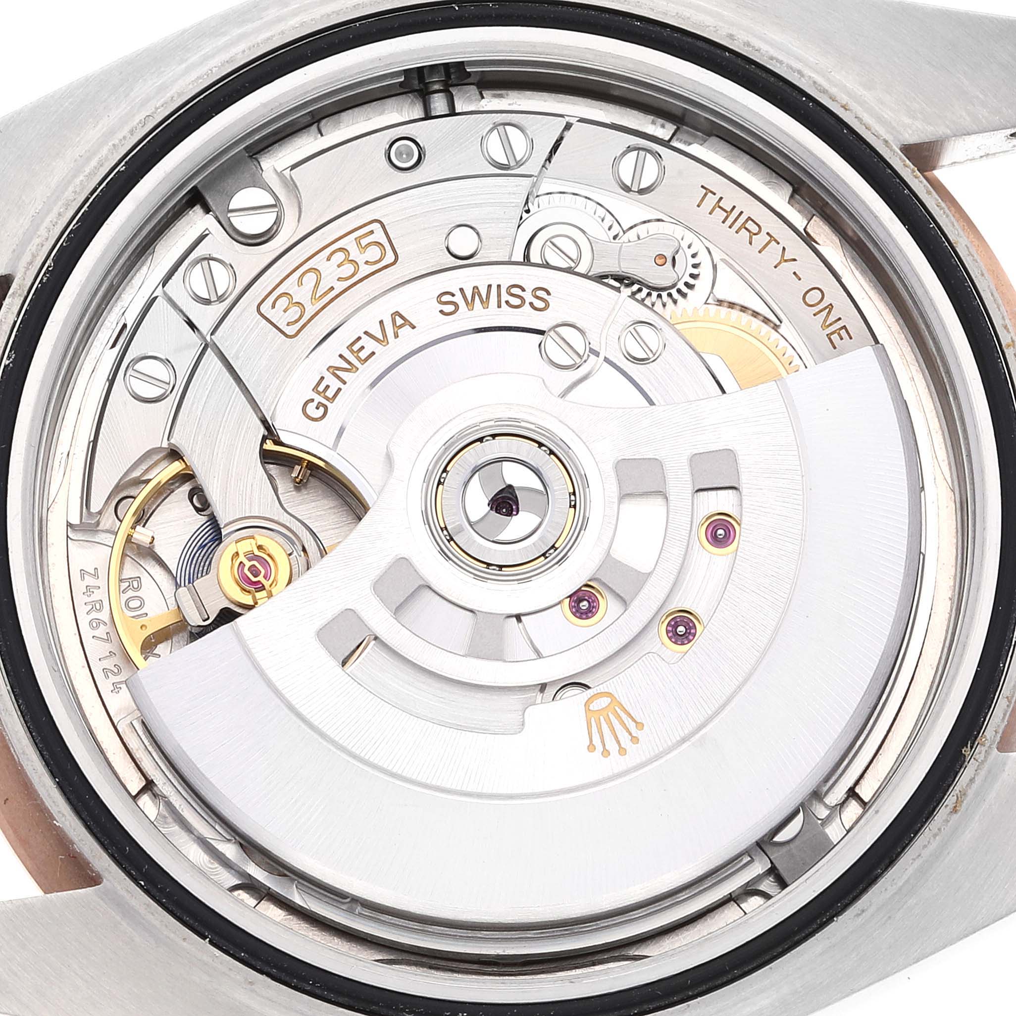 This image shows the inside mechanism of a Rolex Datejust 41 126301 Men
s Steel and Gold (two tone) Pink Dial 126301 Men
s Steel and Gold (two tone) Pink Dial model watch, highlighting the movement and intricate parts.