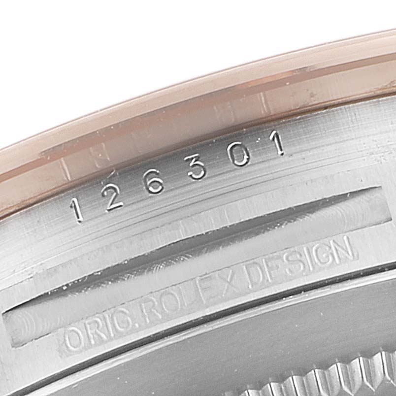 The image shows a close-up angle of the case back and reference number of the Rolex Datejust 41 126301 Men
s Steel and Gold (two tone) Pink Dial 126301 Men
s Steel and Gold (two tone) Pink Dial model.